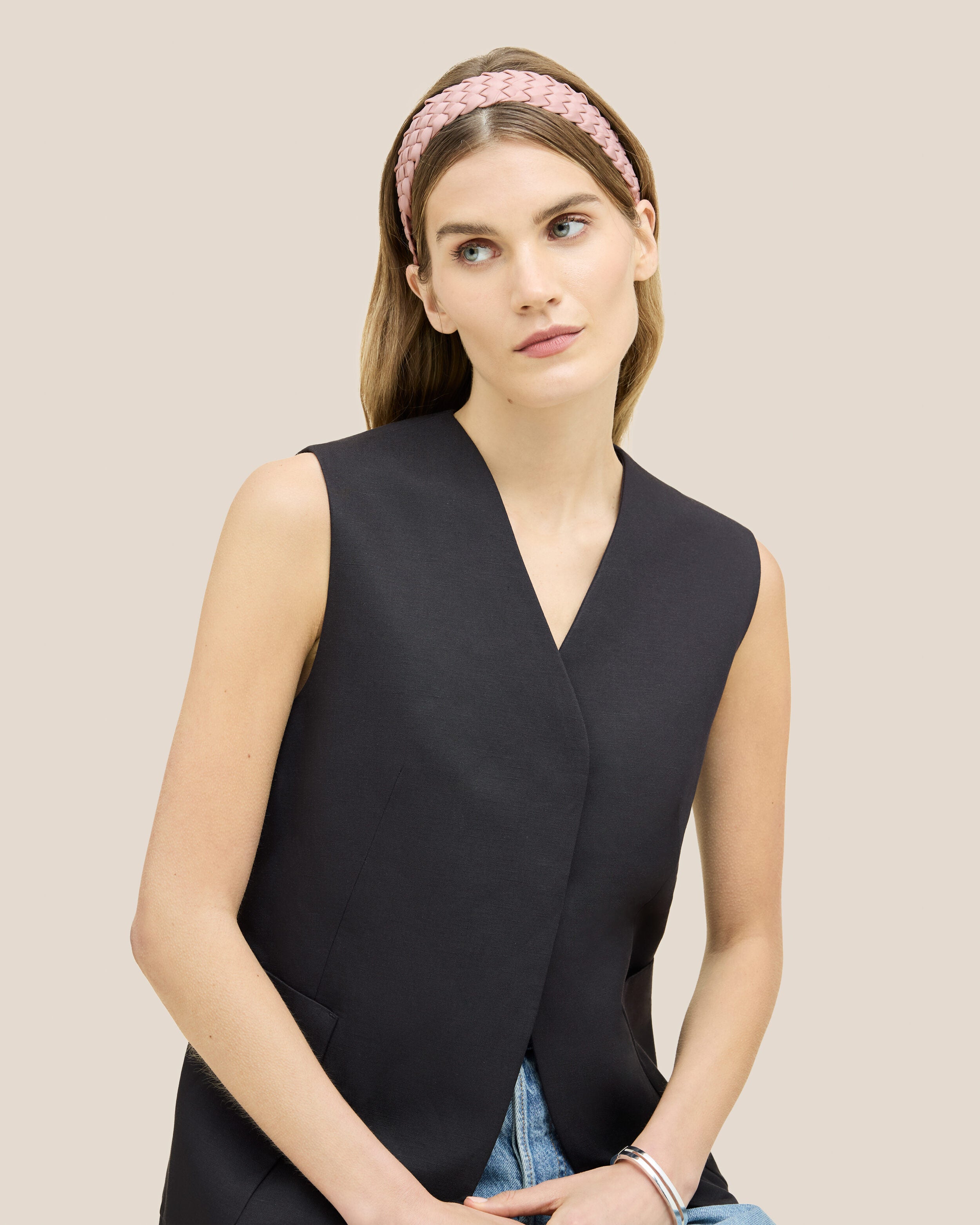 Rivage Headband in Petal shown on model to illustrate scale and soft silhouette.