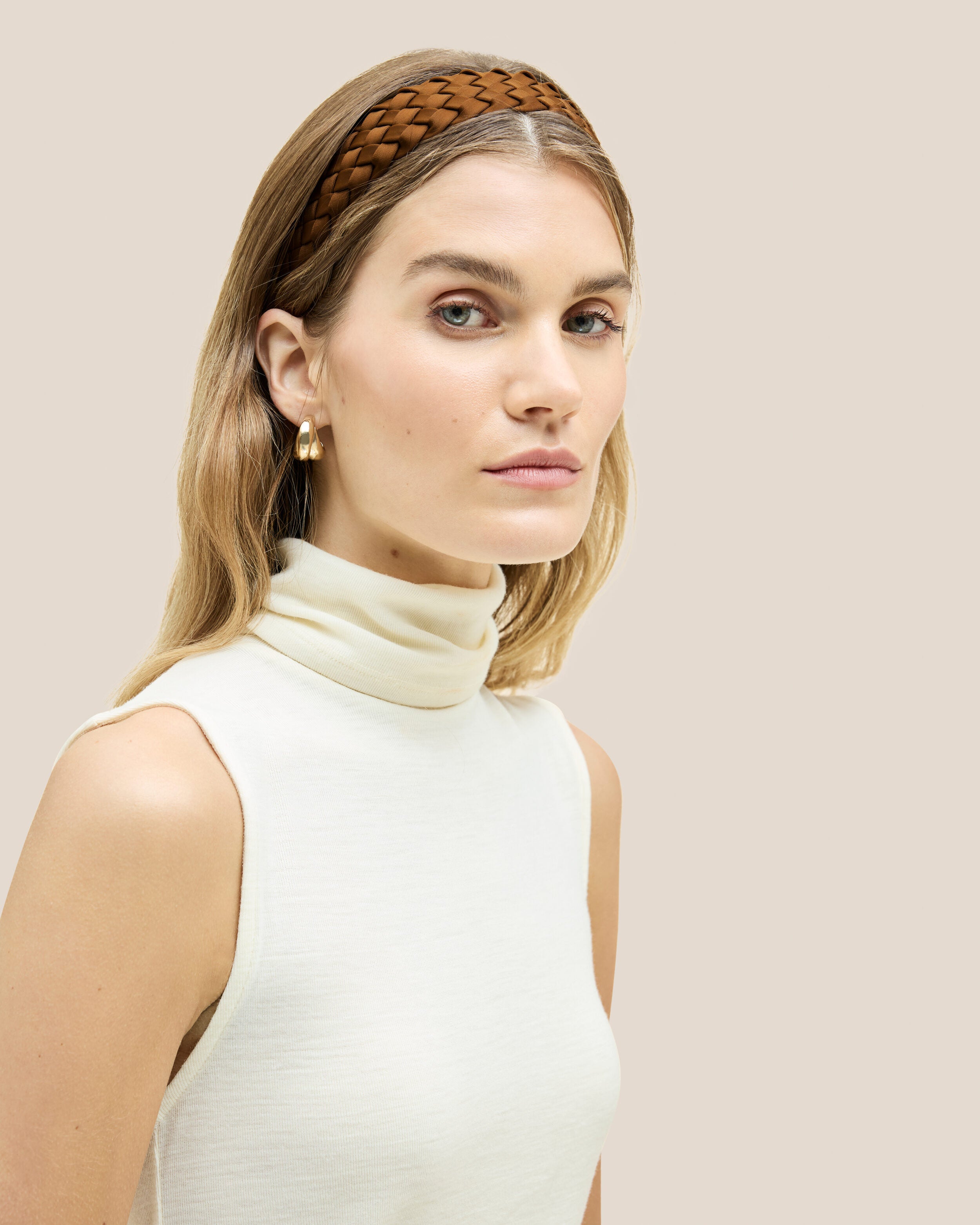 Rivage Headband in Teak shown on model to illustrate scale and soft silhouette.