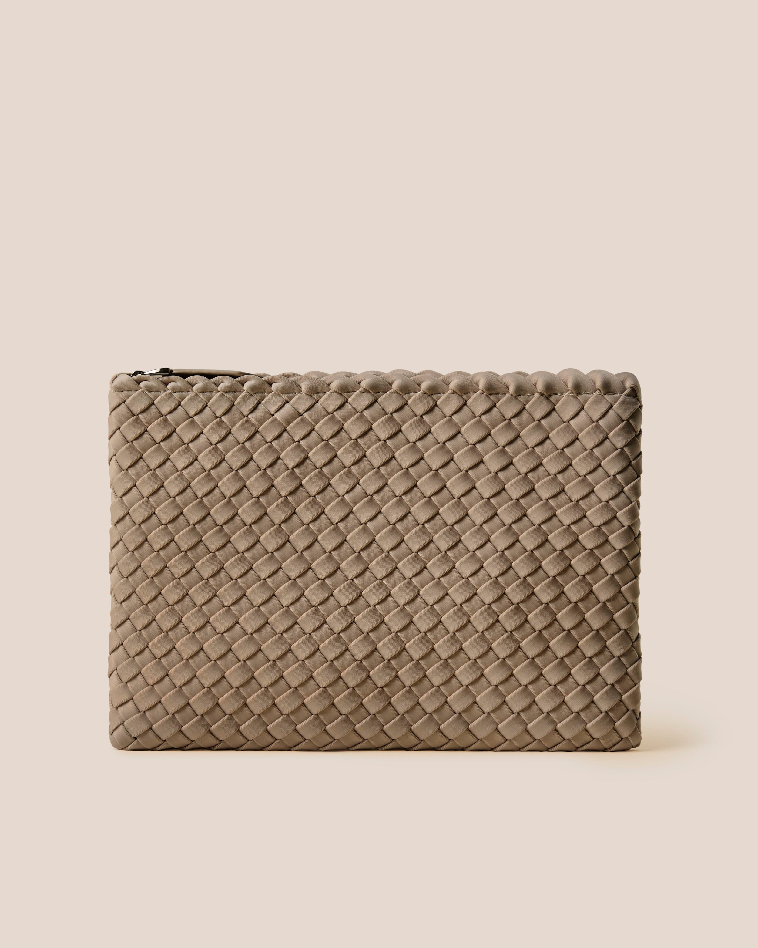 Salina Pouch in Cashmere, a taupe tone, in handwoven neoprene, featuring a zip closure.