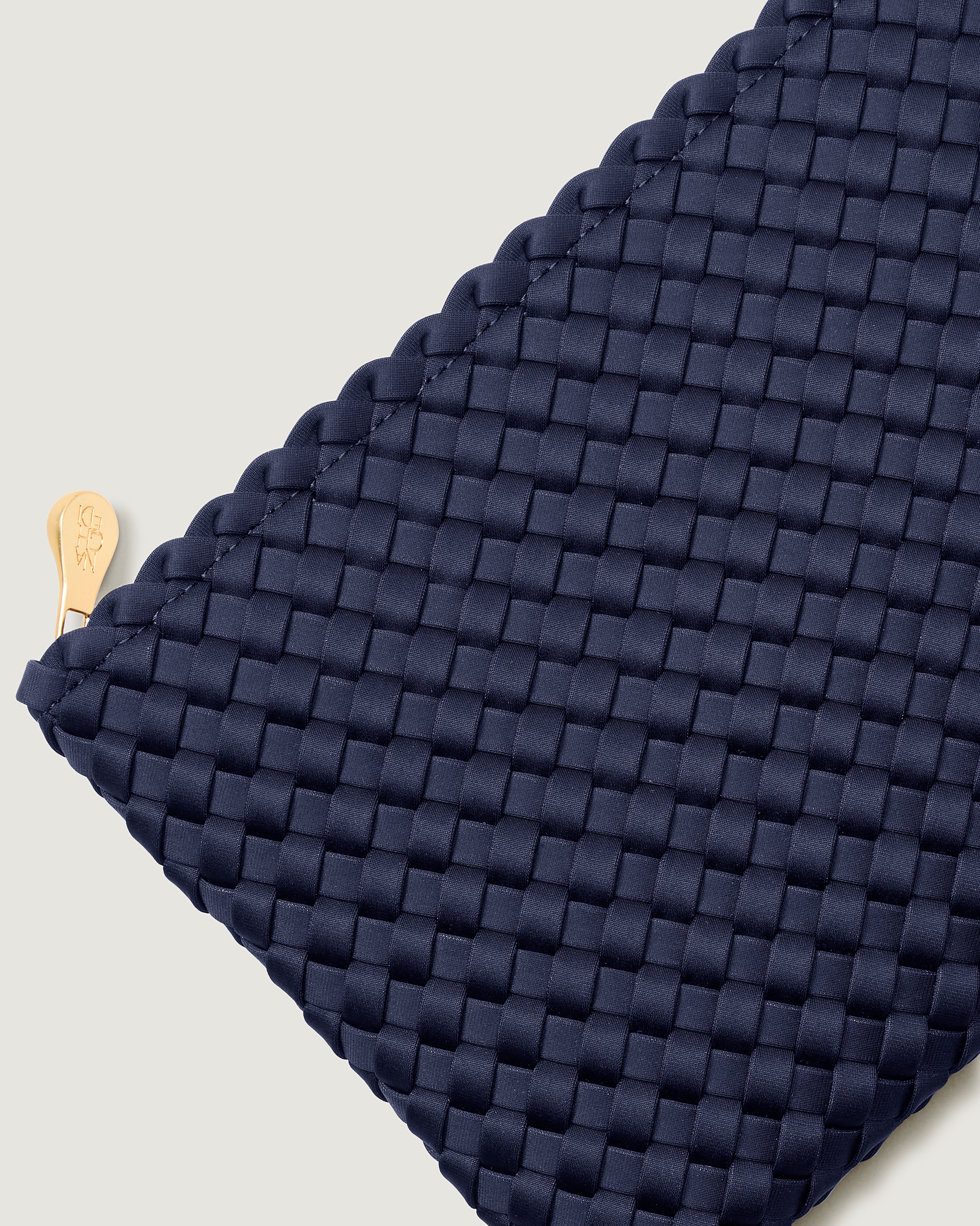 Close up of Salina Pouch featuring the brushed gold zipper.