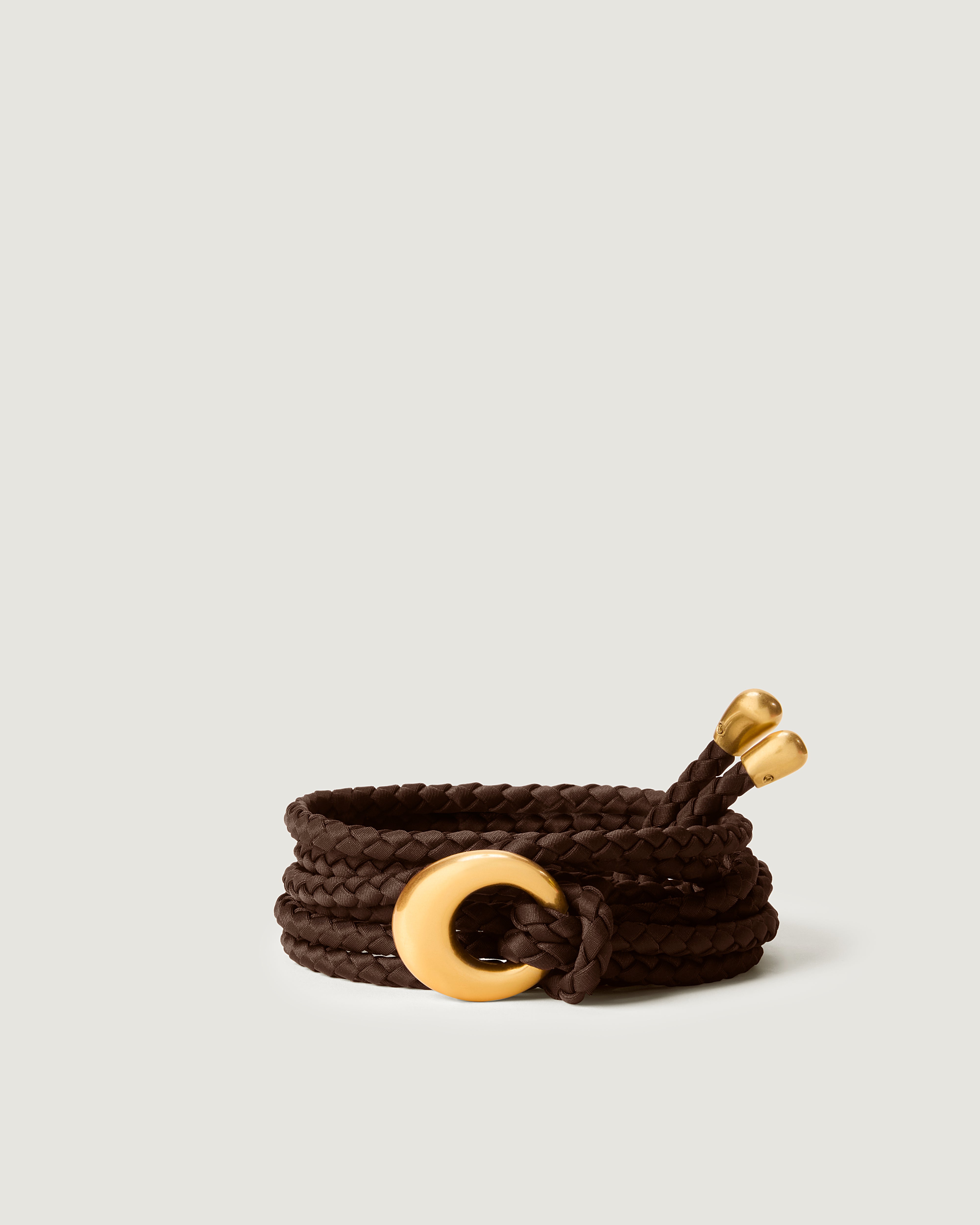 Detailed view of the Salta Belt in Chocolate featuring custom hardware buckle and tips.