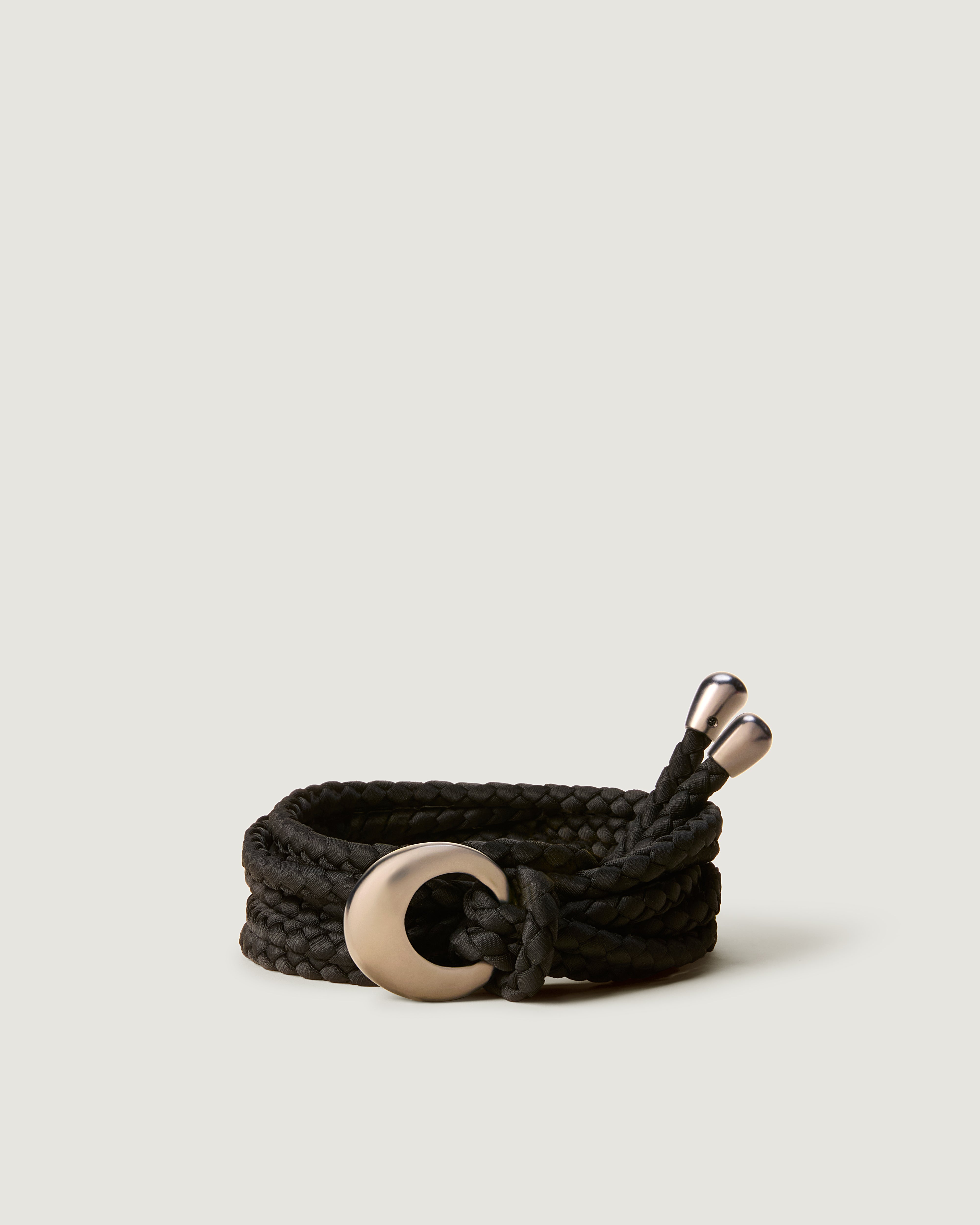 Detailed view of the Salta Belt in Onyx featuring custom hardware buckle and tips.