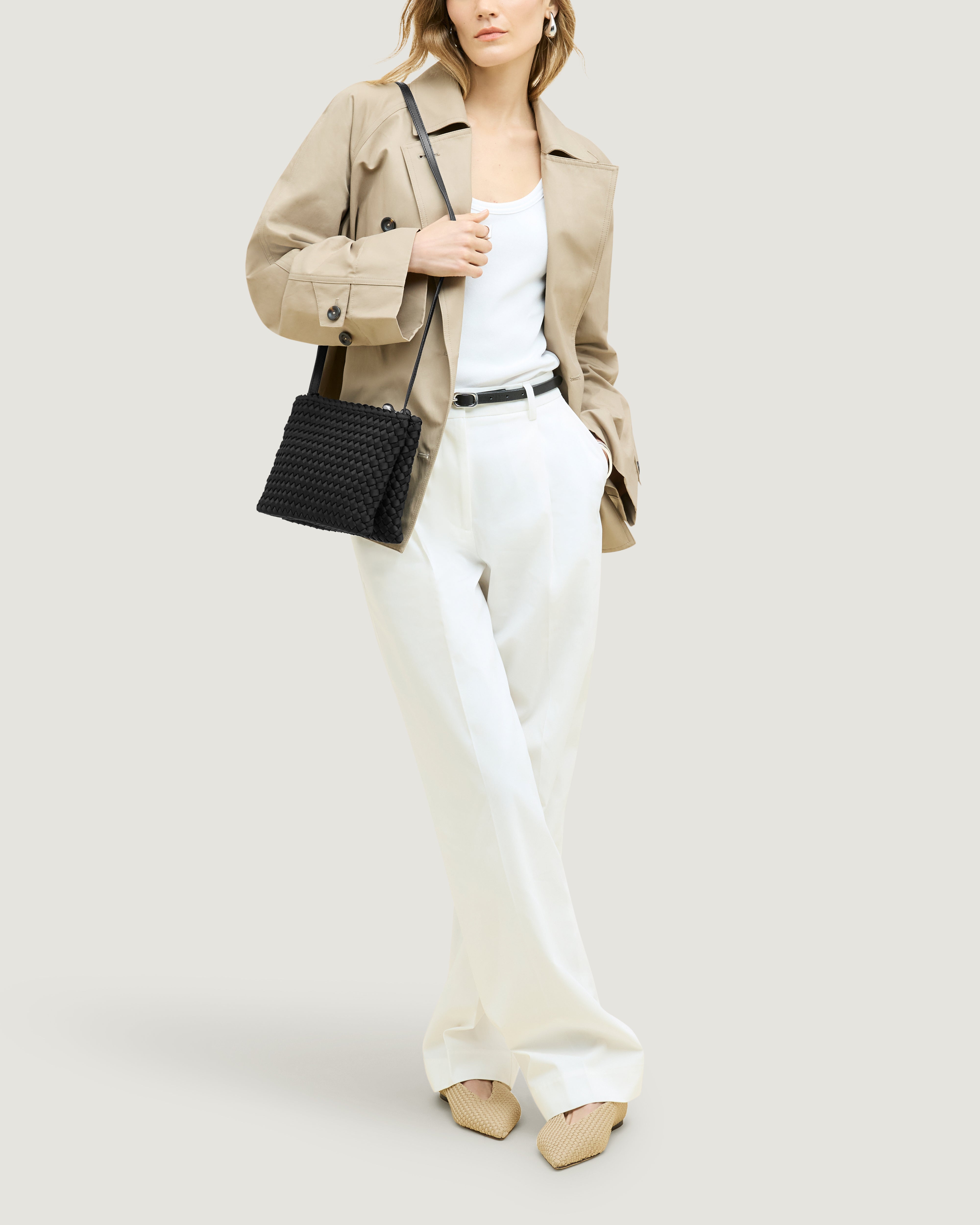 Soho Envelope in Onyx shown on model to illustrate scale and soft silhouette.