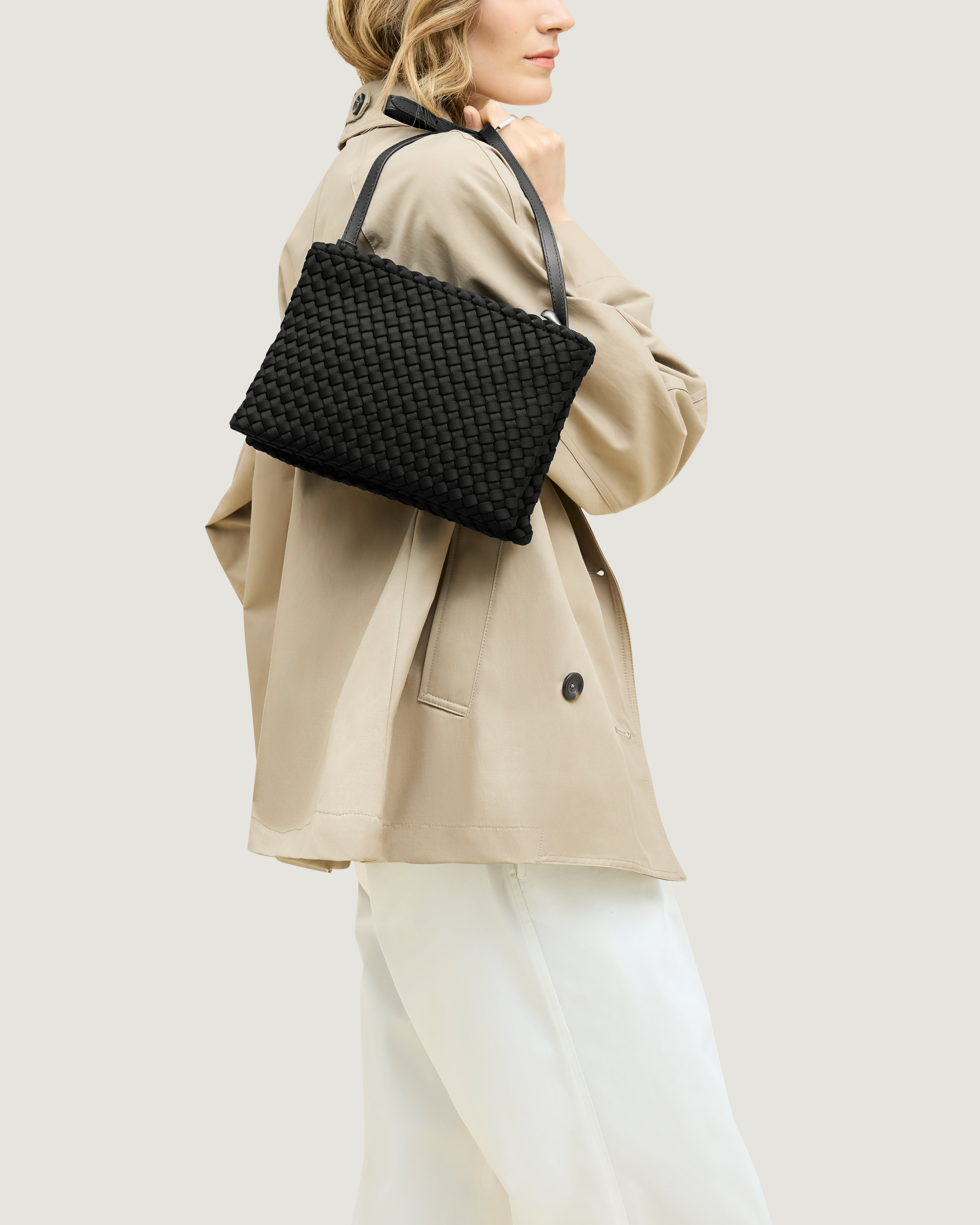 Soho Envelope in Onyx shown on model to illustrate scale and soft silhouette.