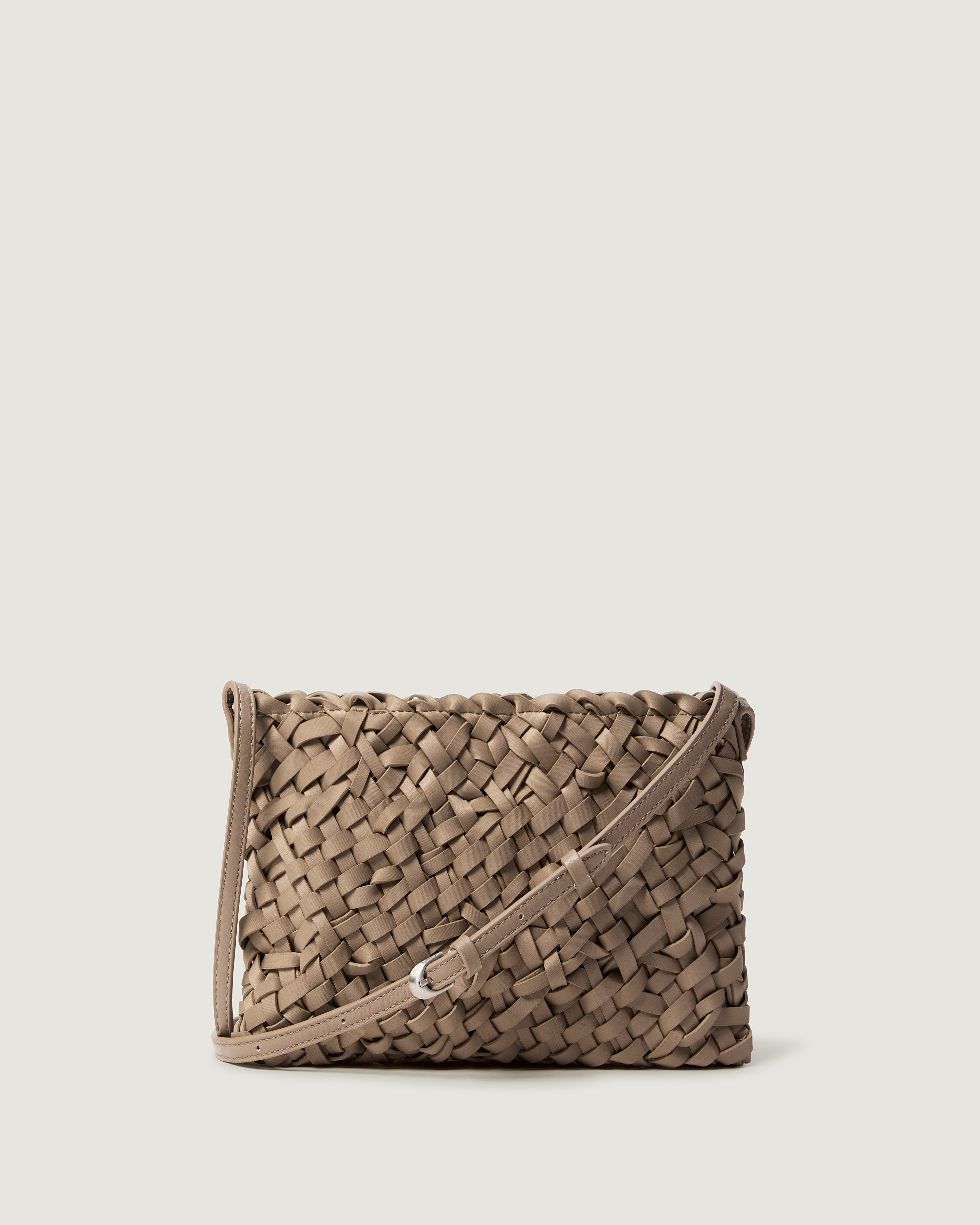 Handwoven neoprene crossbody bag in cool taupe color with a crosshatch nest weave pattern