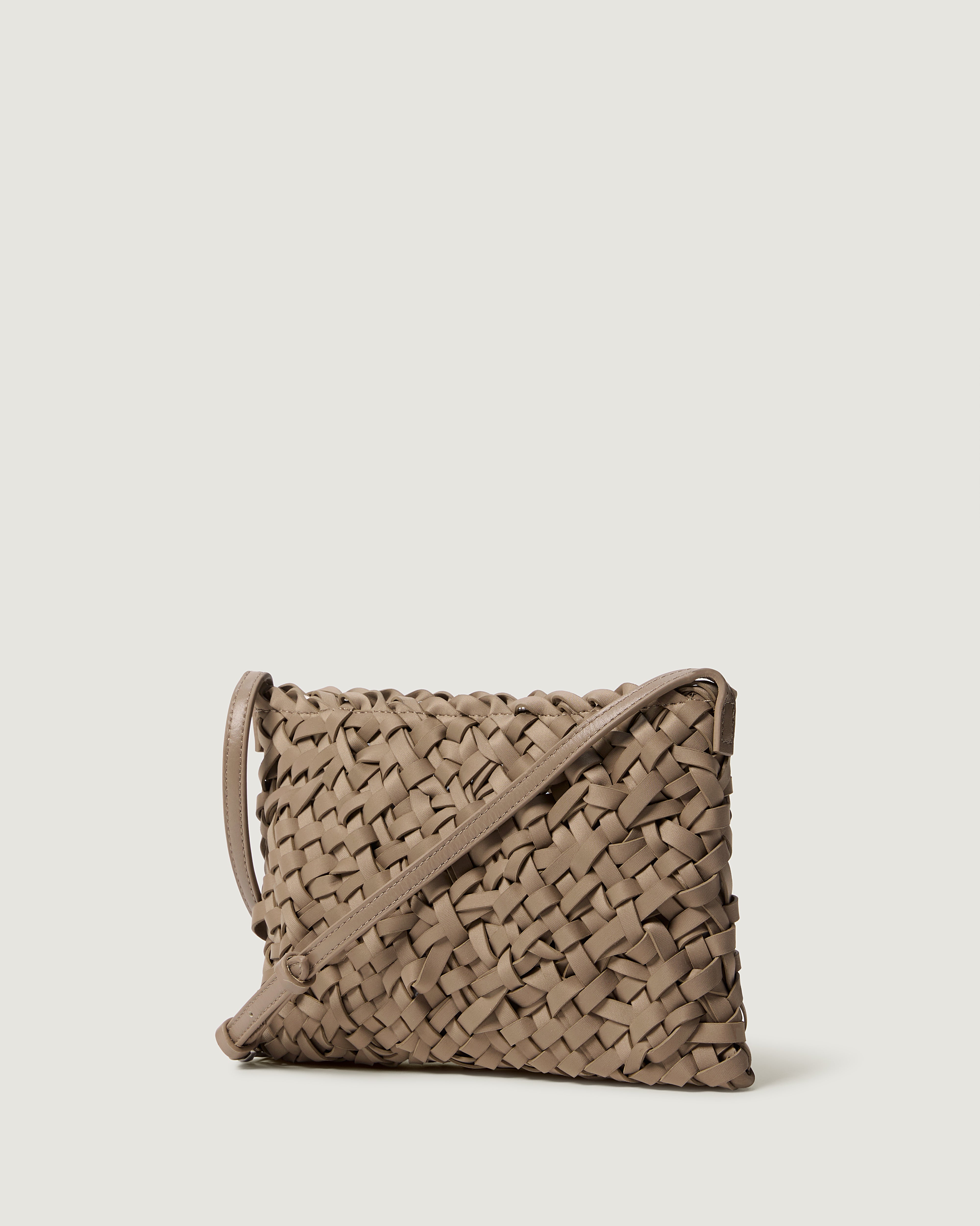 Side view of handwoven neoprene crossbody bag in cool taupe color with a crosshatch nest weave pattern.
