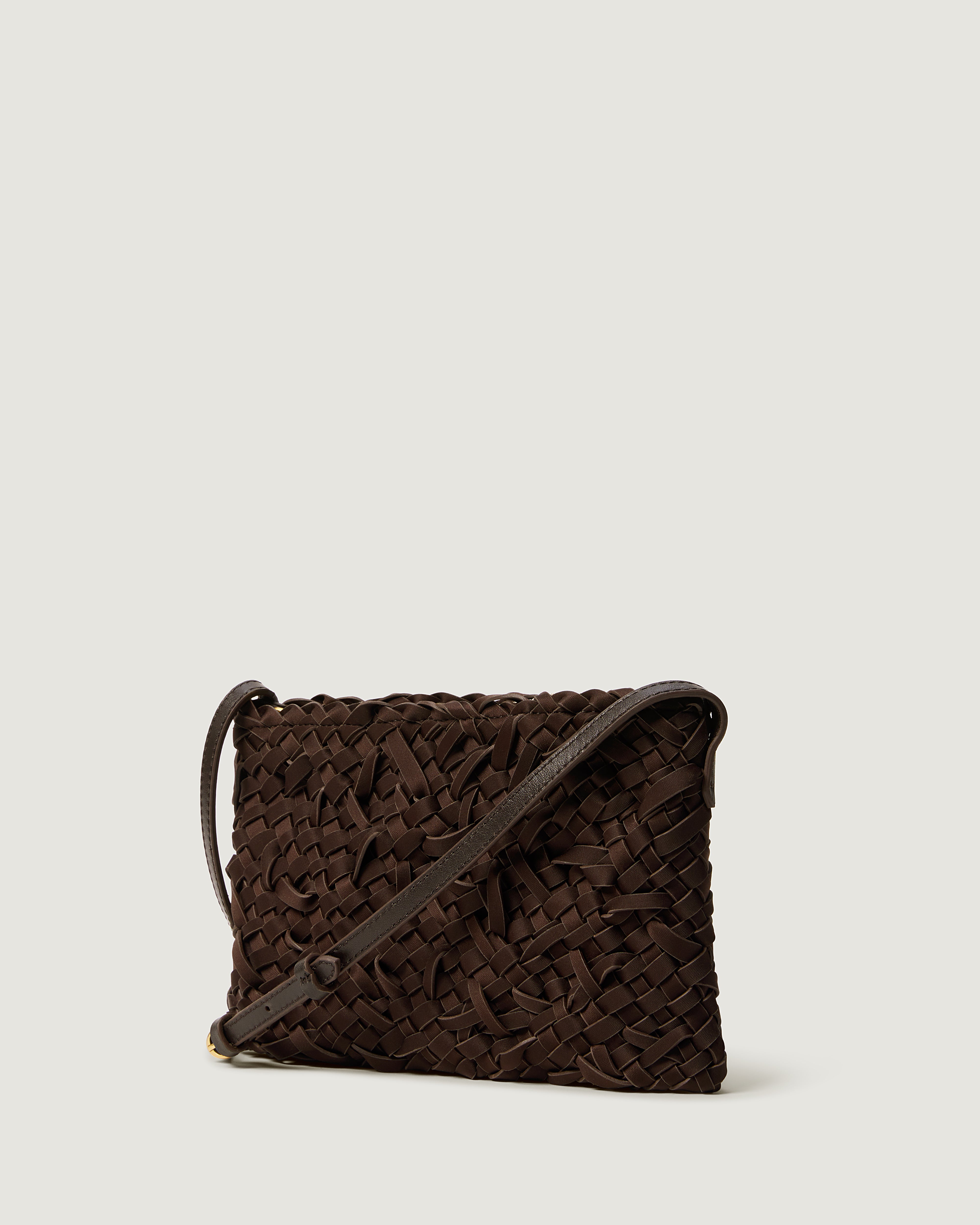 Side view of handwoven neoprene crossbody bag in chocolate brown color in a crosshatch nest weave pattern.