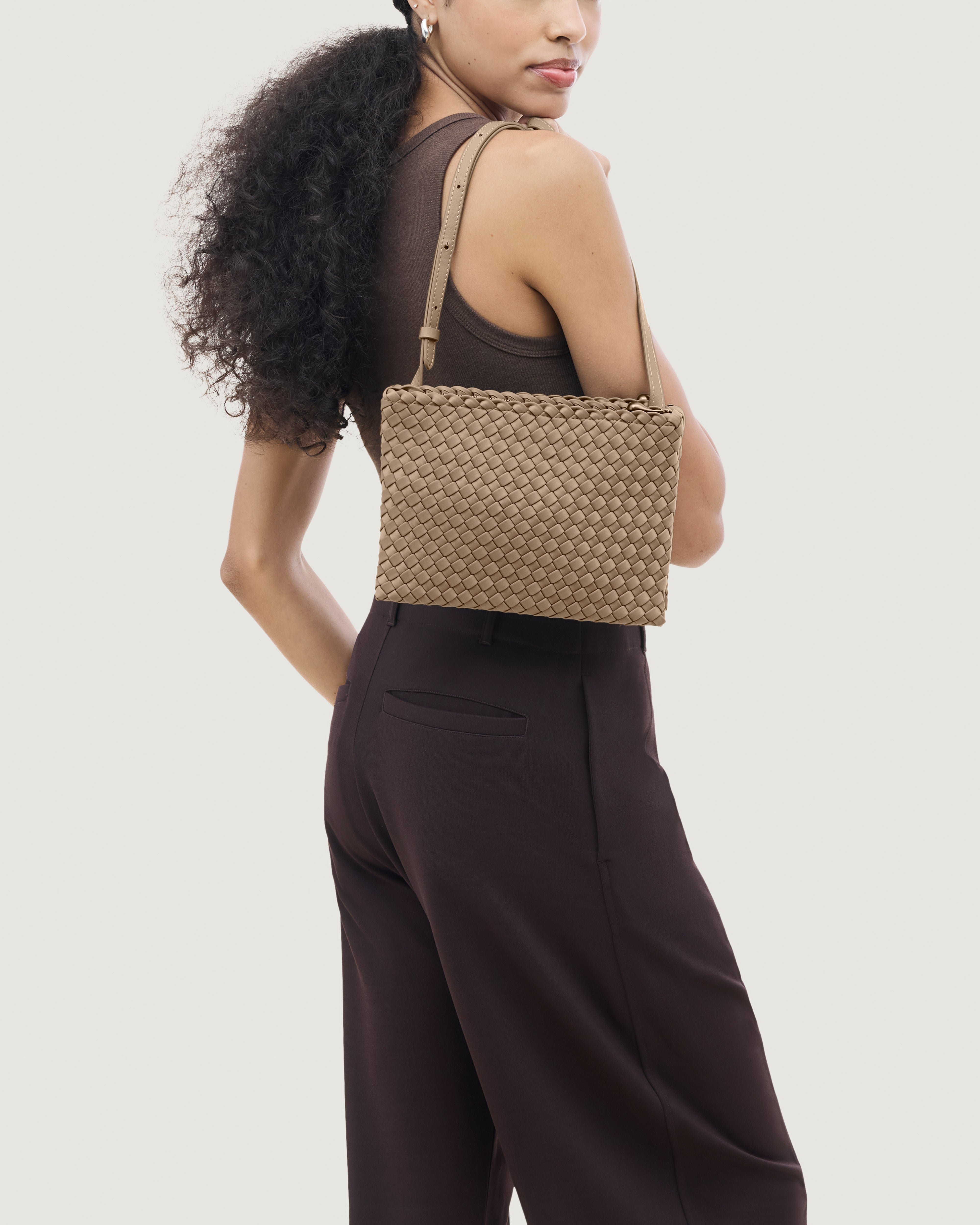 Soho Envelope Crossbody in Cashmere shown on model to illustrate scale and soft silhouette.