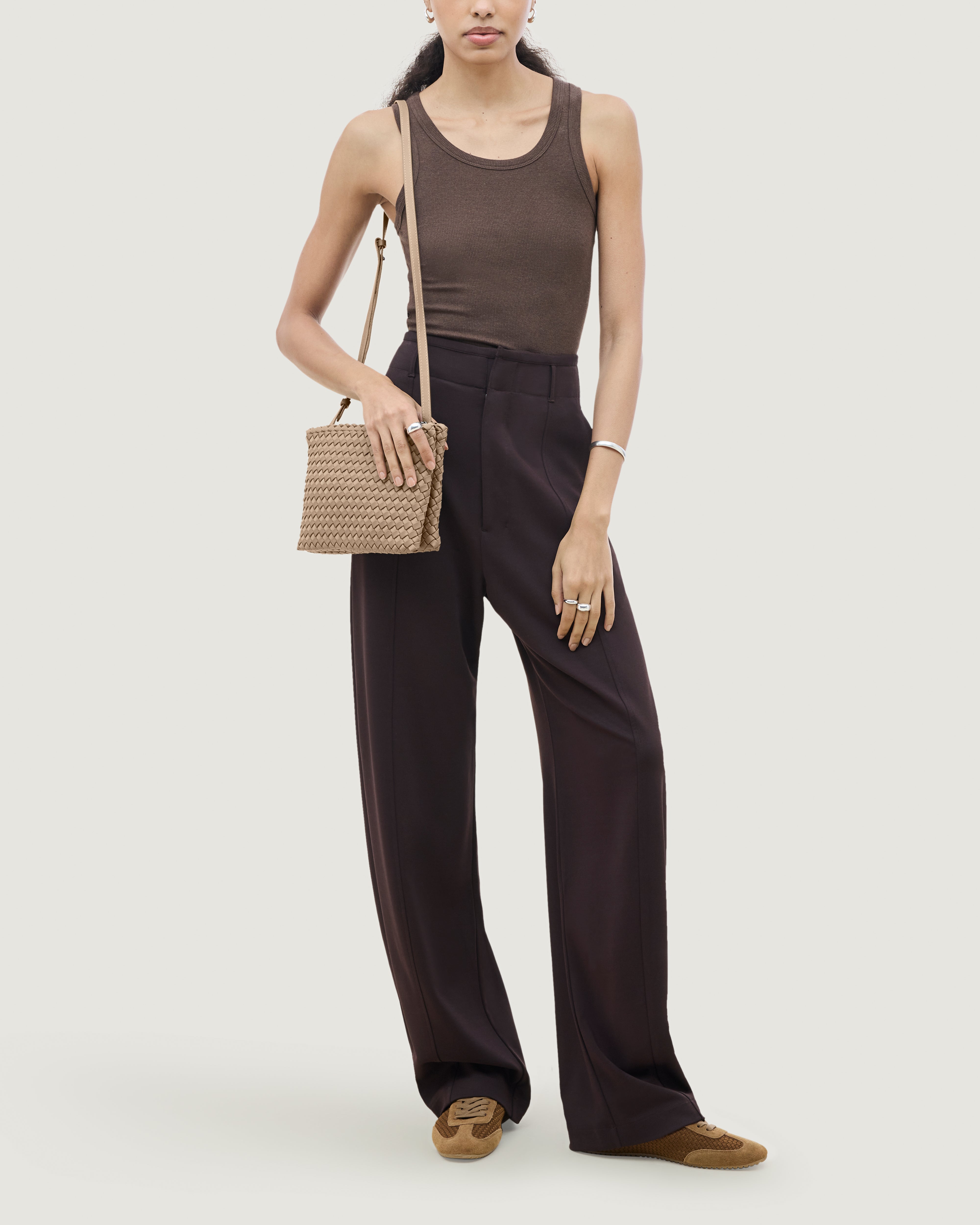 Soho Envelope Crossbody in Cashmere shown on model to illustrate scale and soft silhouette.