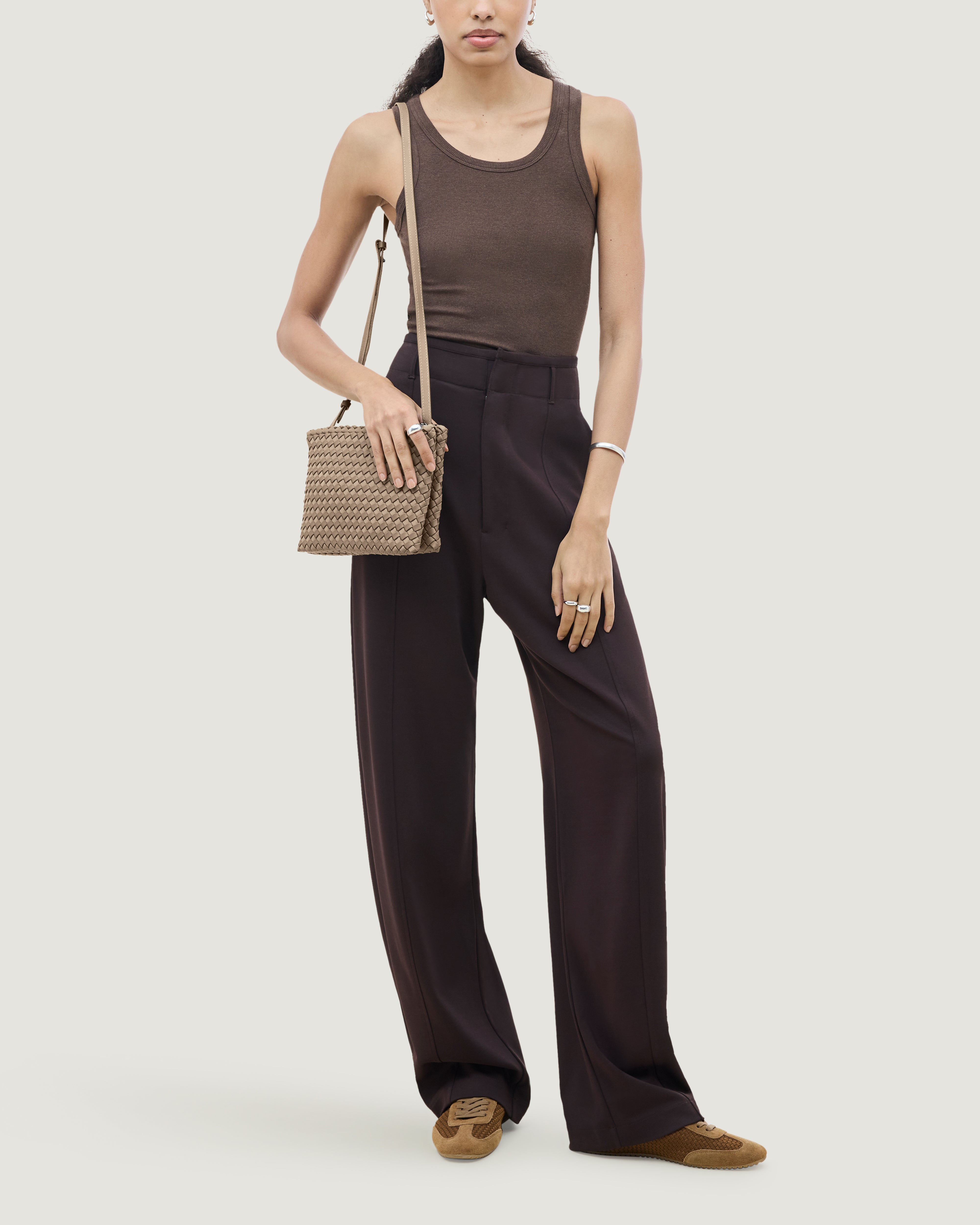 Soho Envelope Crossbody in Cashmere shown on model to illustrate scale and soft silhouette.