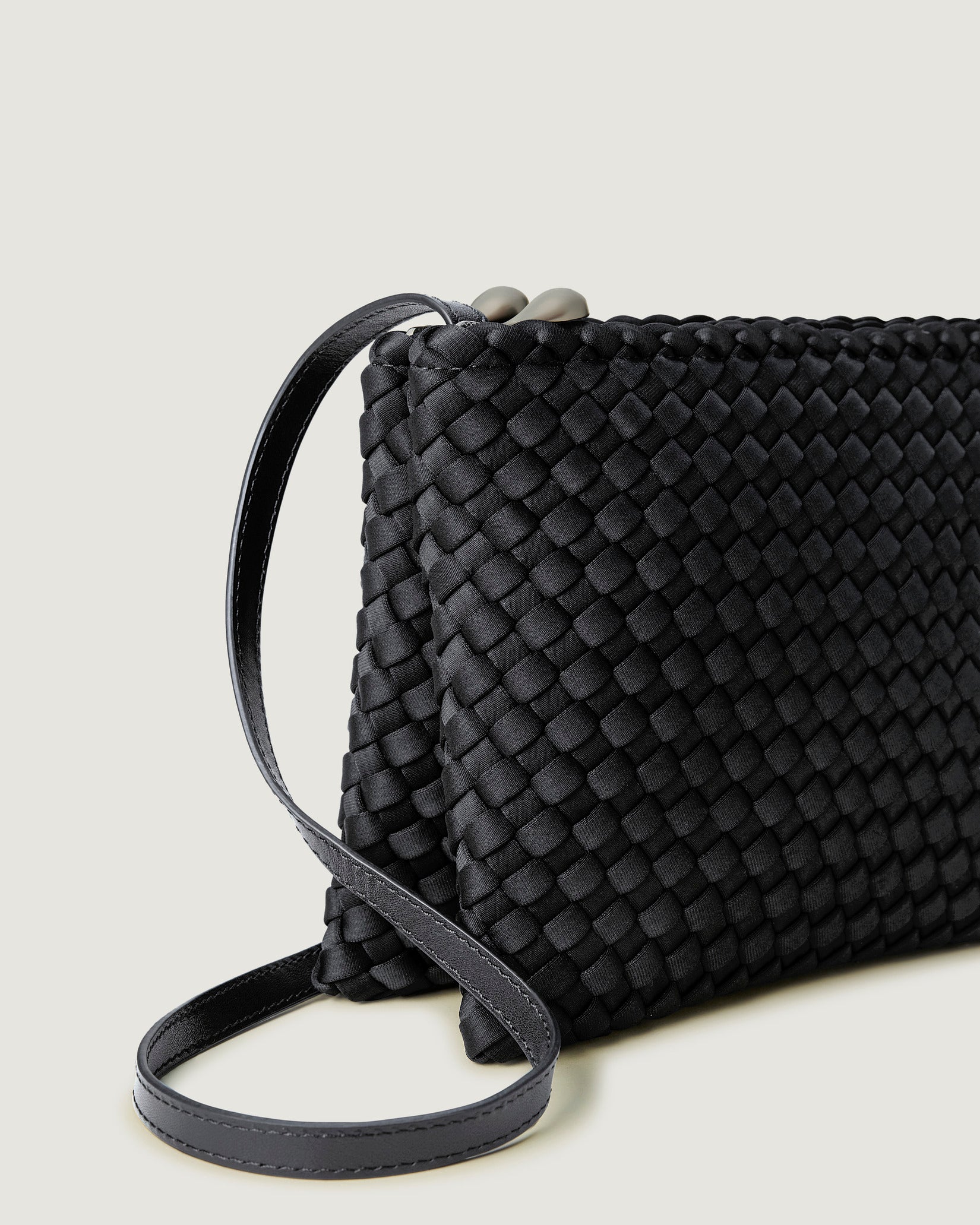 Close-up of handwoven detailing on Soho Medium Envelope Crossbody in Ash.