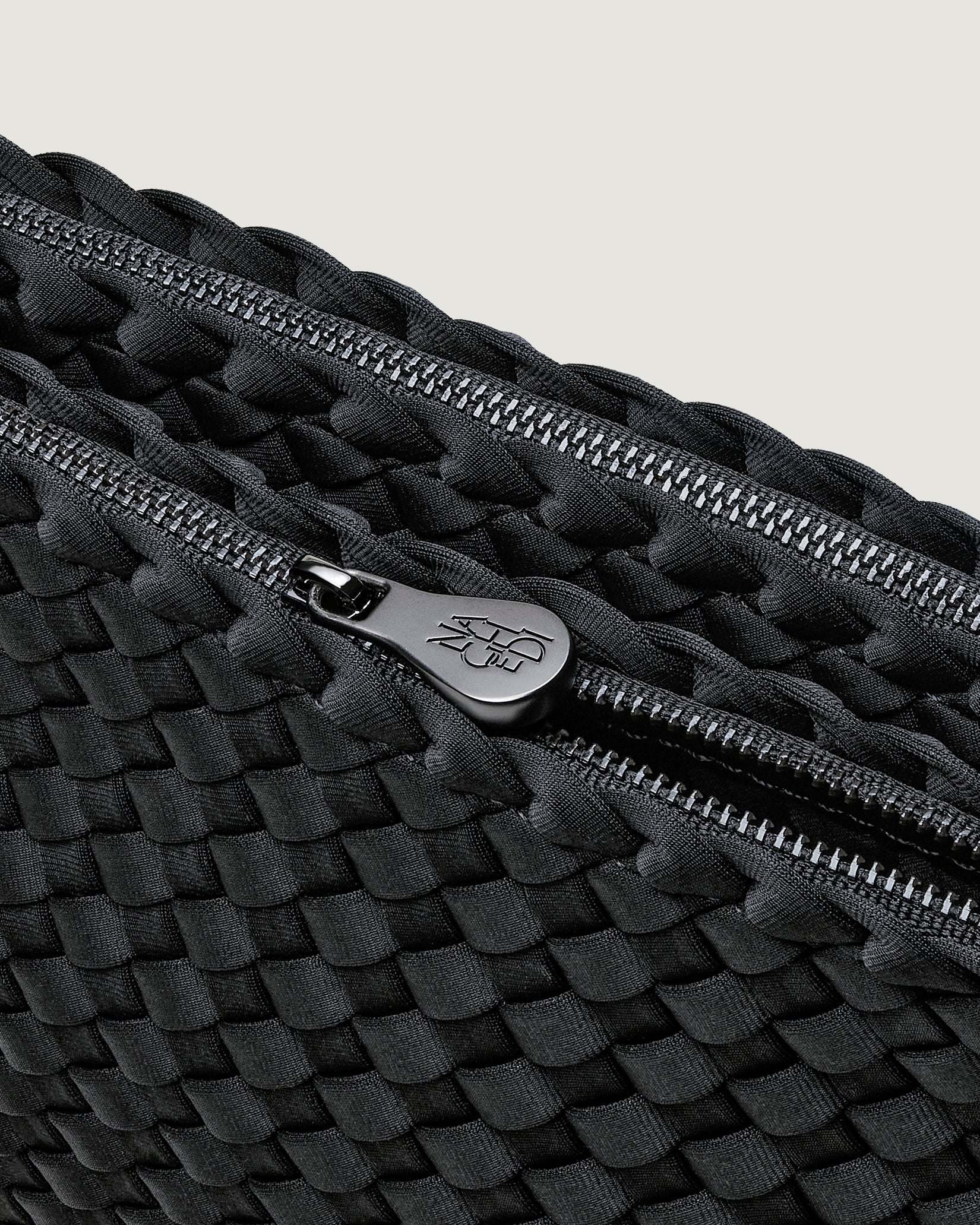Interior close-up of Soho Medium Envelope Crossbody in Ash showing its dual zip top closure, and unlined interior.