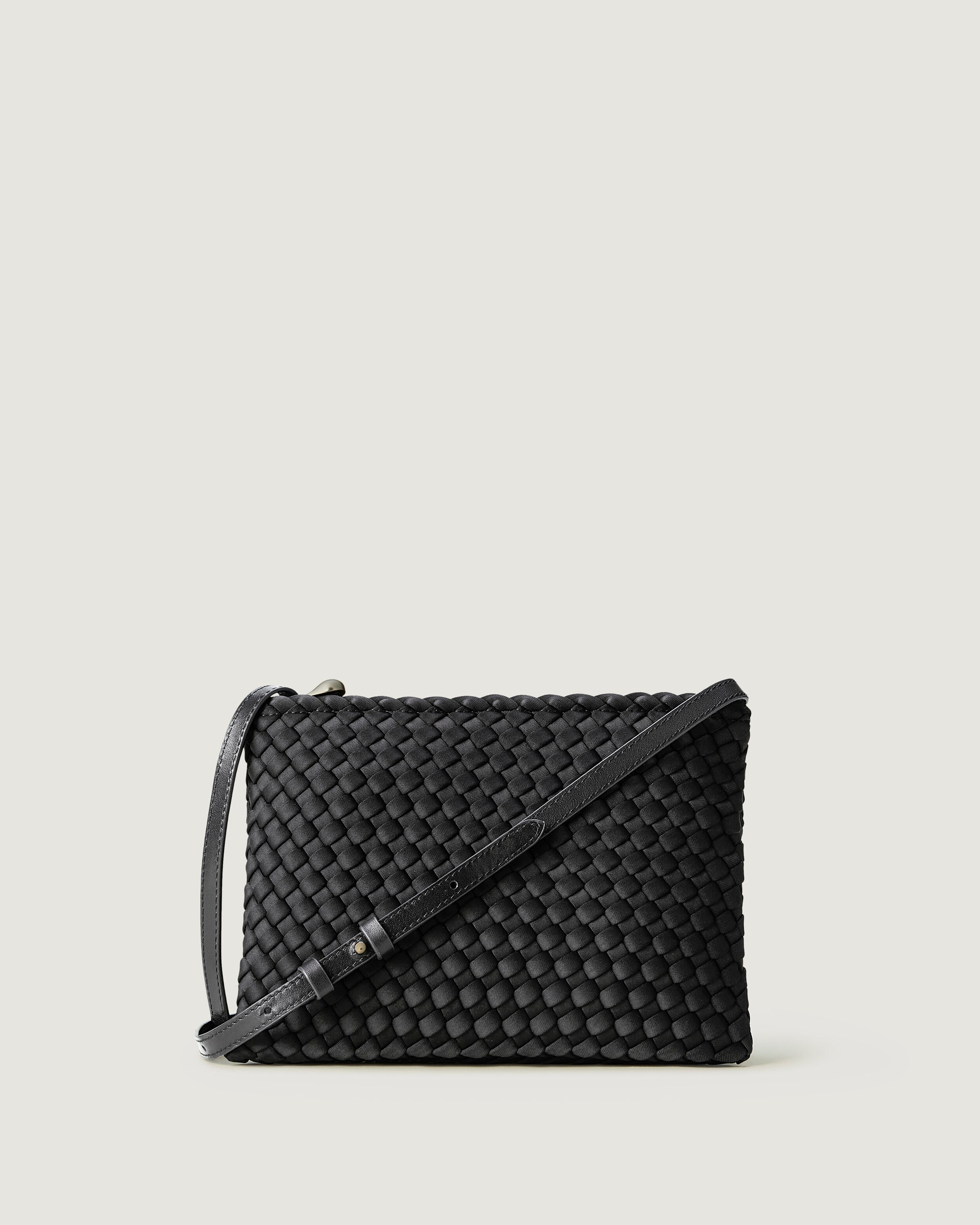 Soho Envelope in Ash, a slate gray  tone, in handwoven neoprene, featuring a dual zip top closure, and adjustable leather crossbody strap.