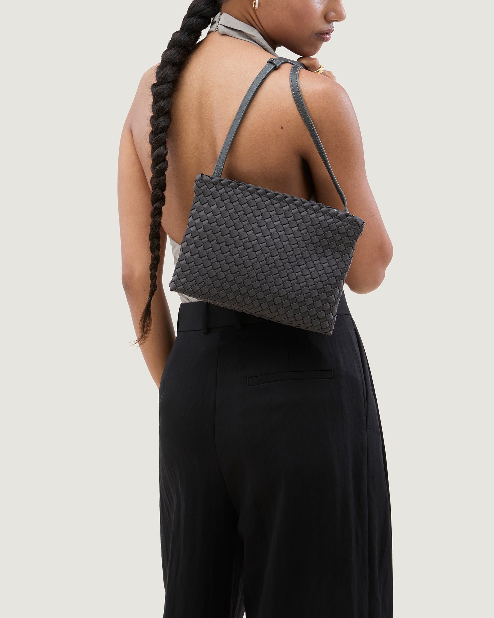 Soho Medium Envelope Crossbody in Ash shown on model to illustrate scale and soft silhouette.