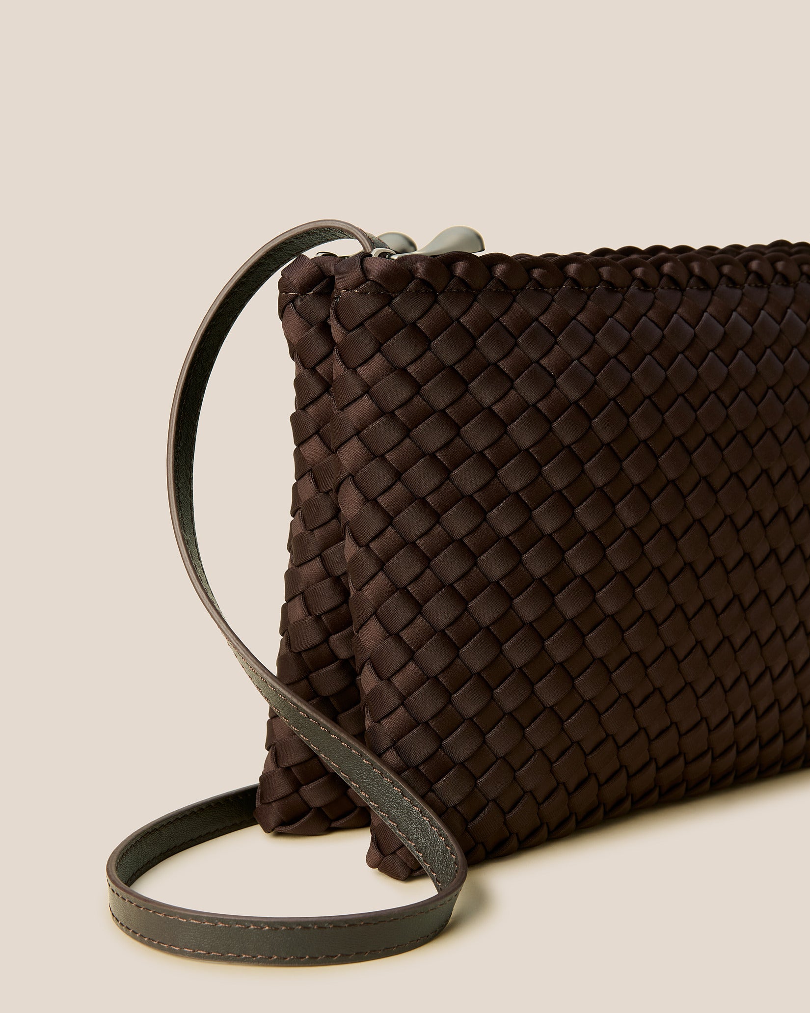 Close-up of handwoven detailing on Soho Medium Envelope Crossbody in Chocolate.