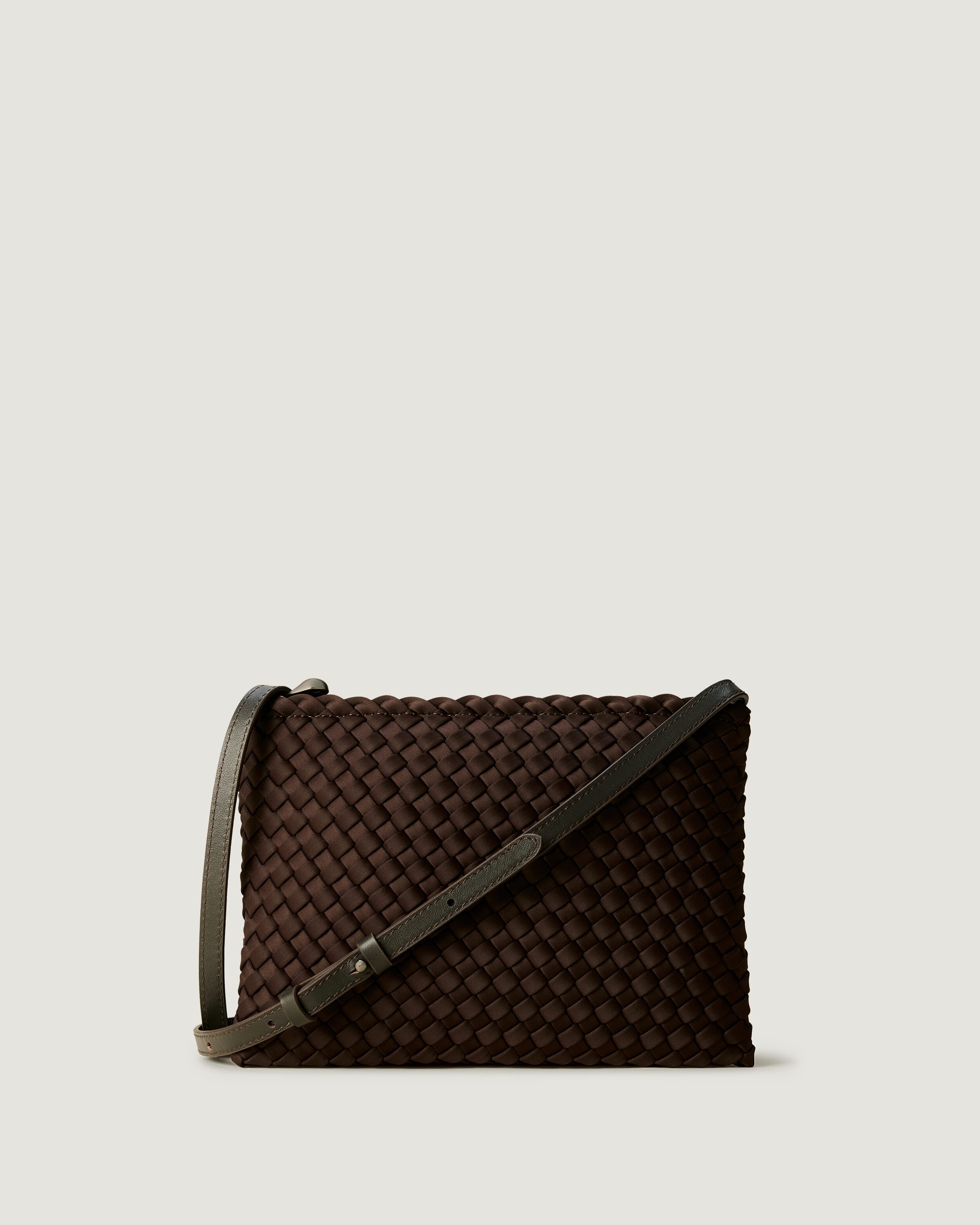 Soho Envelope in Chocolate, a dark chocolate brown tone, in handwoven neoprene, featuring a dual zip top closure, and adjustable leather crossbody strap.