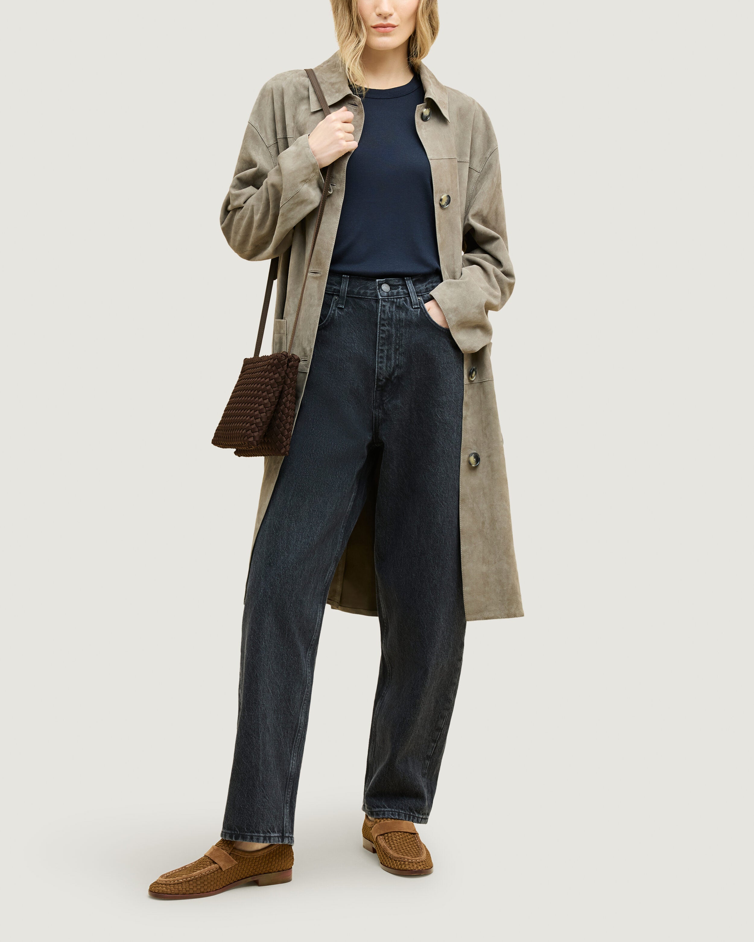 Soho Envelope in Chocolate shown on model to illustrate scale and soft silhouette.