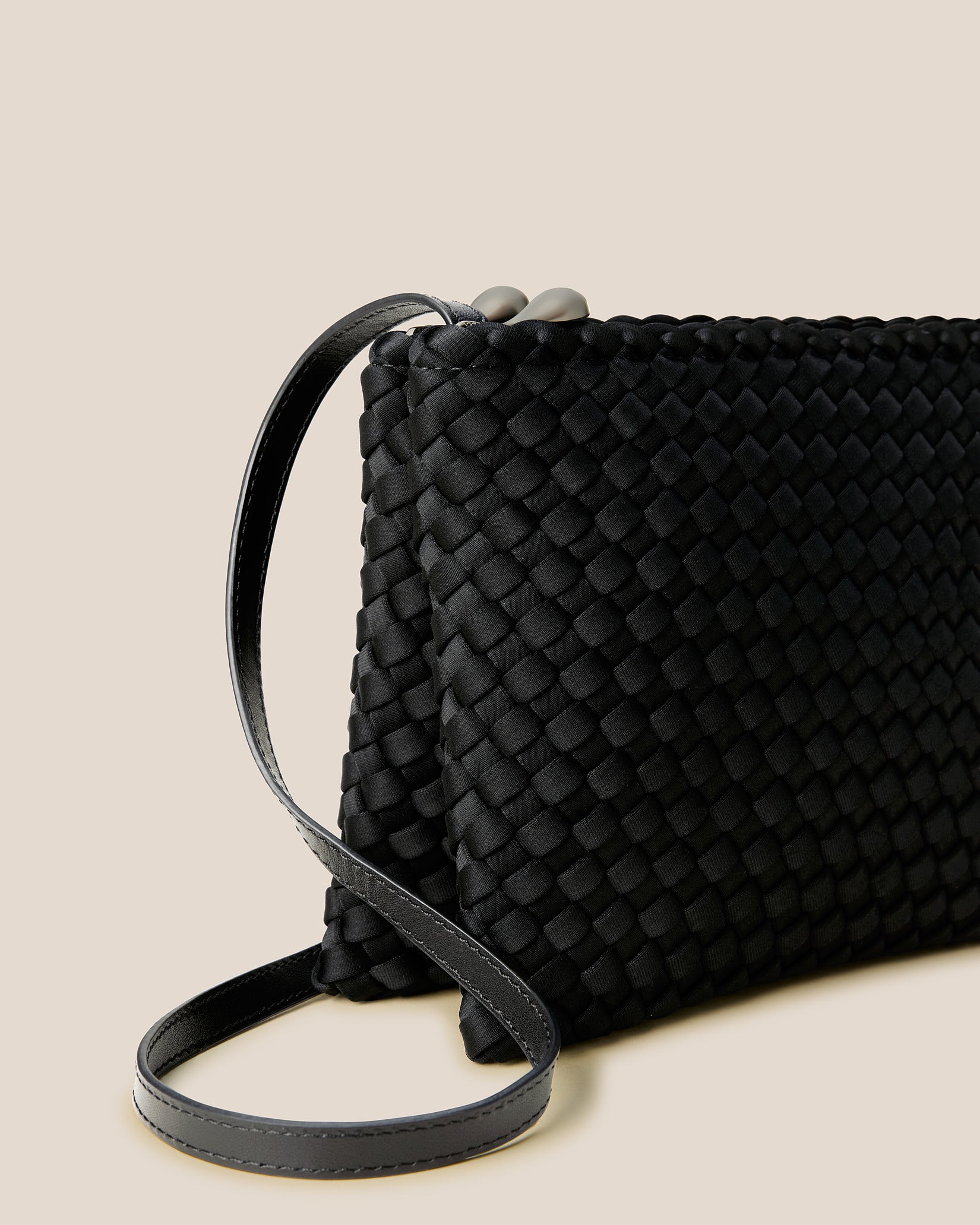 Close-up of handwoven detailing on Soho Medium Envelope Crossbody in Onyx.