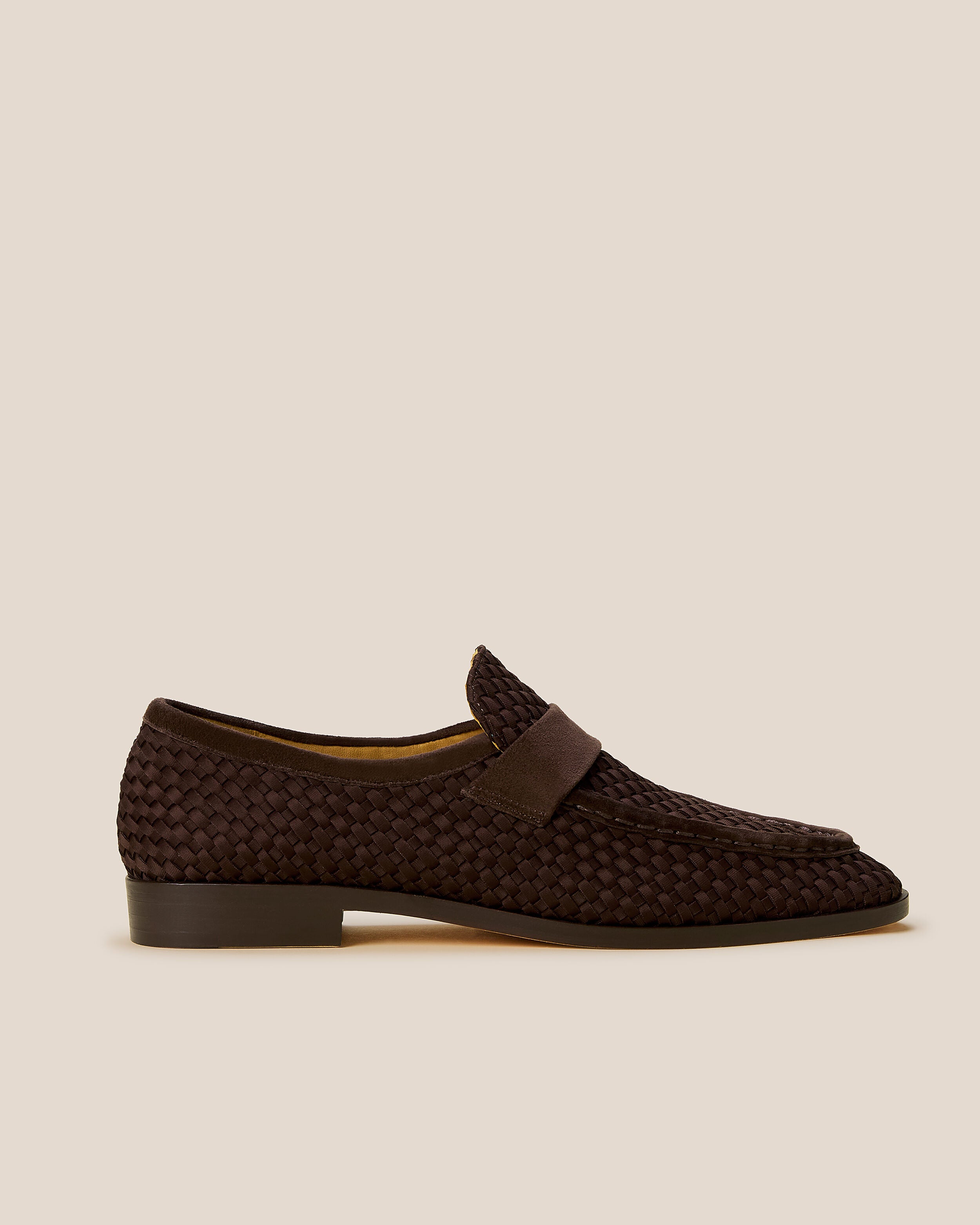 Side view of The Sonoma Loafer in Chocolate, a dark chocolate brown tone, featuring a closed toe and round silhouette.