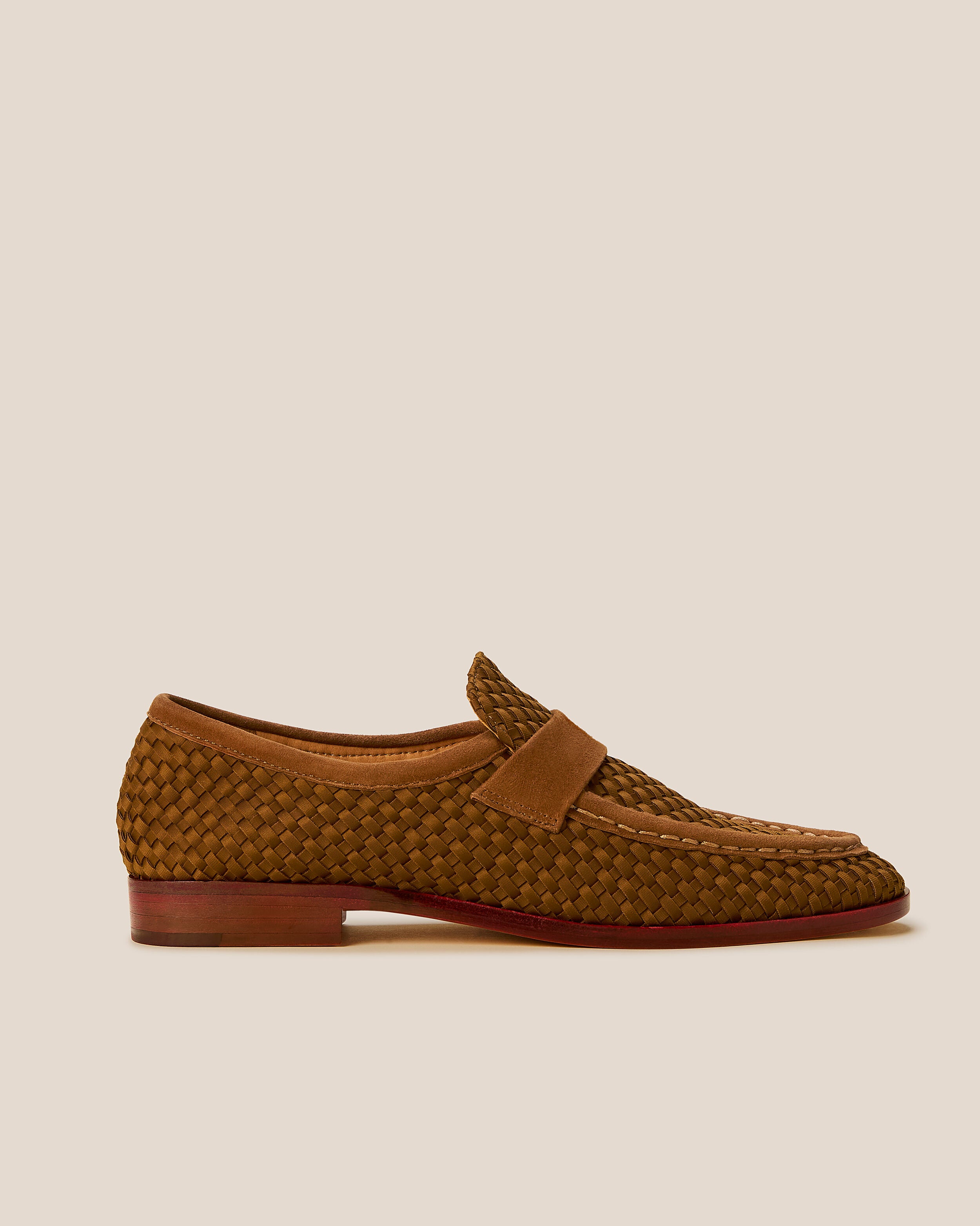 Side view of The Sonoma Loafer in Teak, a saddle brown tone, featuring a closed toe and round silhouette.