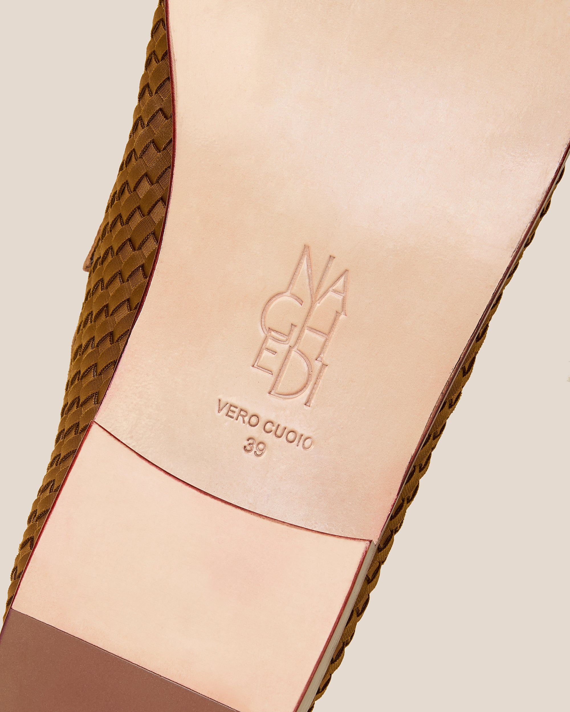 Shoe sole showing stamped NAGHEDI logo and size detail for Sonoma Loafers in Teak.