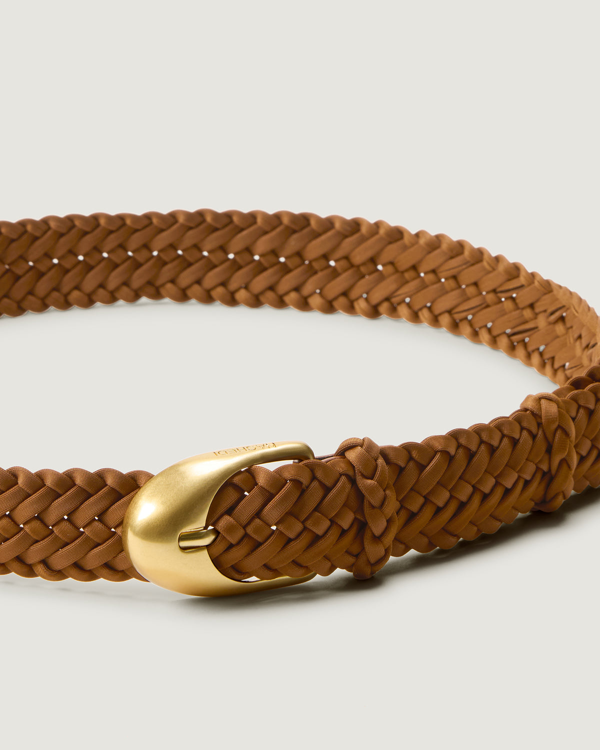 Close up view of brushed gold bucket on the Sonora Belt in Teak