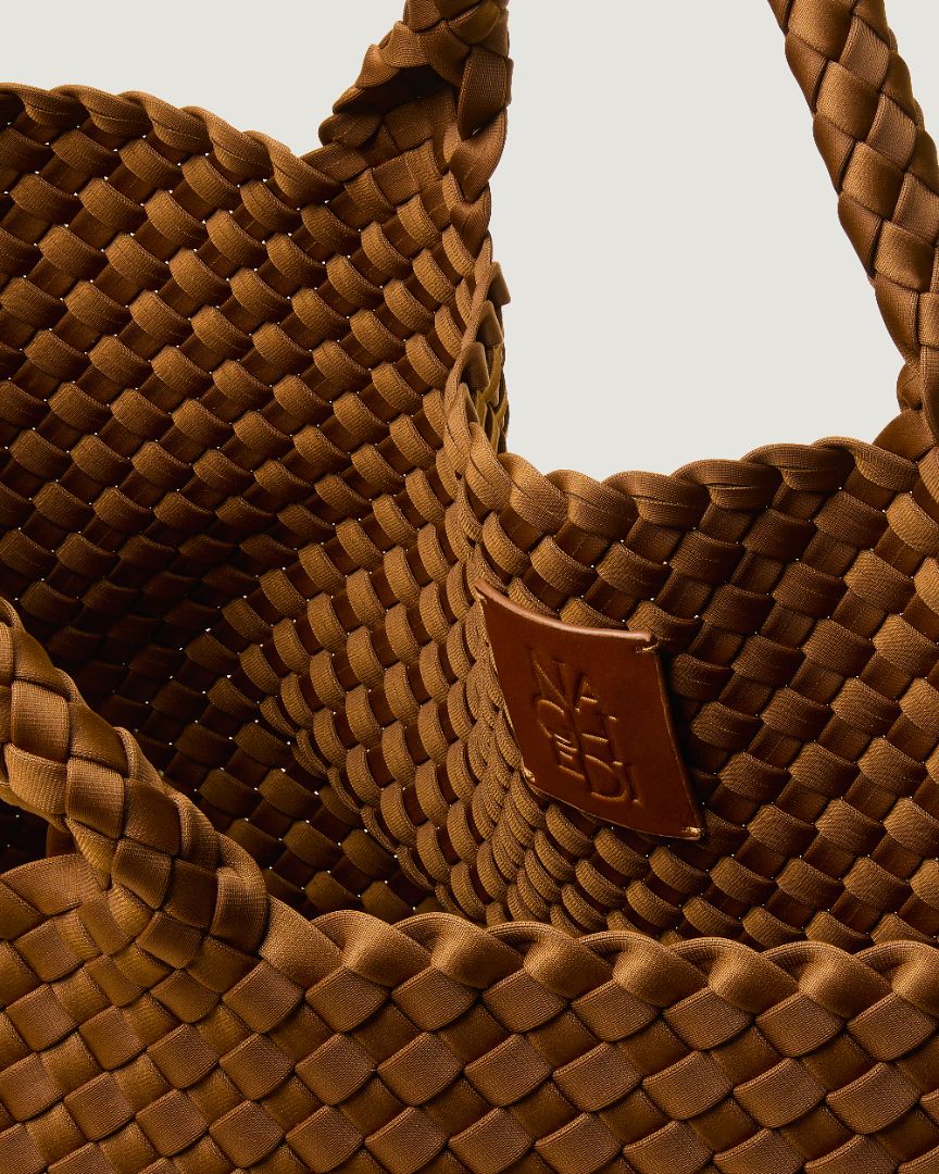 Interior close-up of St. Barths Tote in Teak showing its open top, and unlined interior.