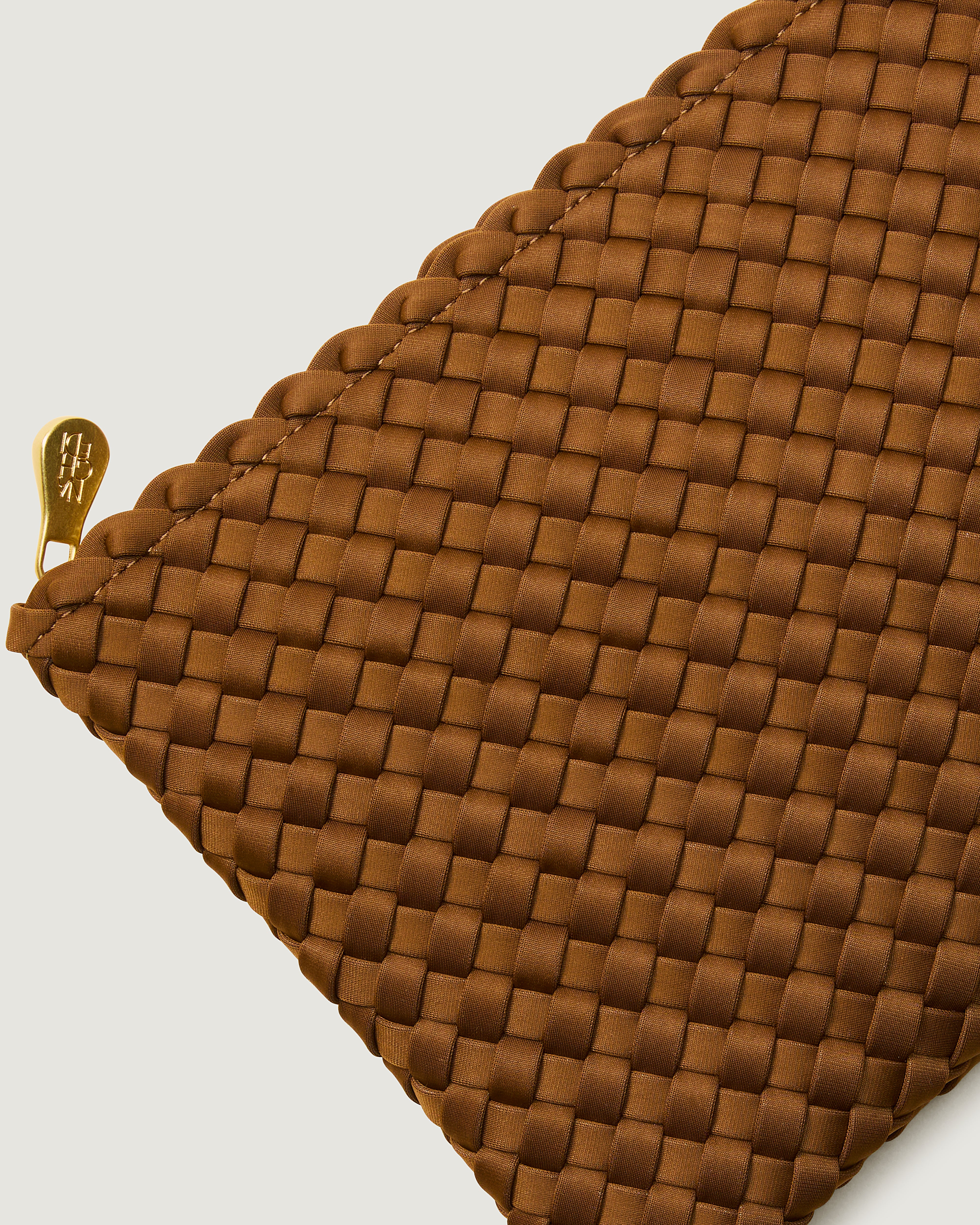 Close-up of included matching woven zippered pouch.