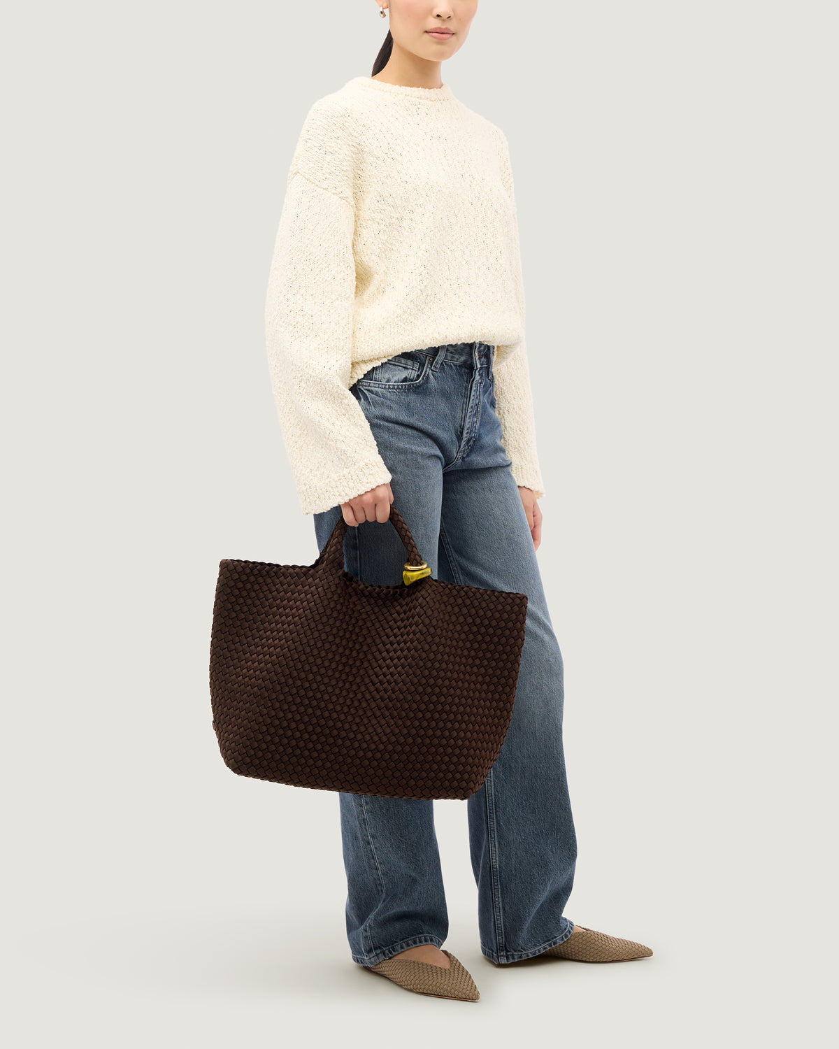 St. Barths Tote in Chocolate shown on model to illustrate scale and soft silhouette.