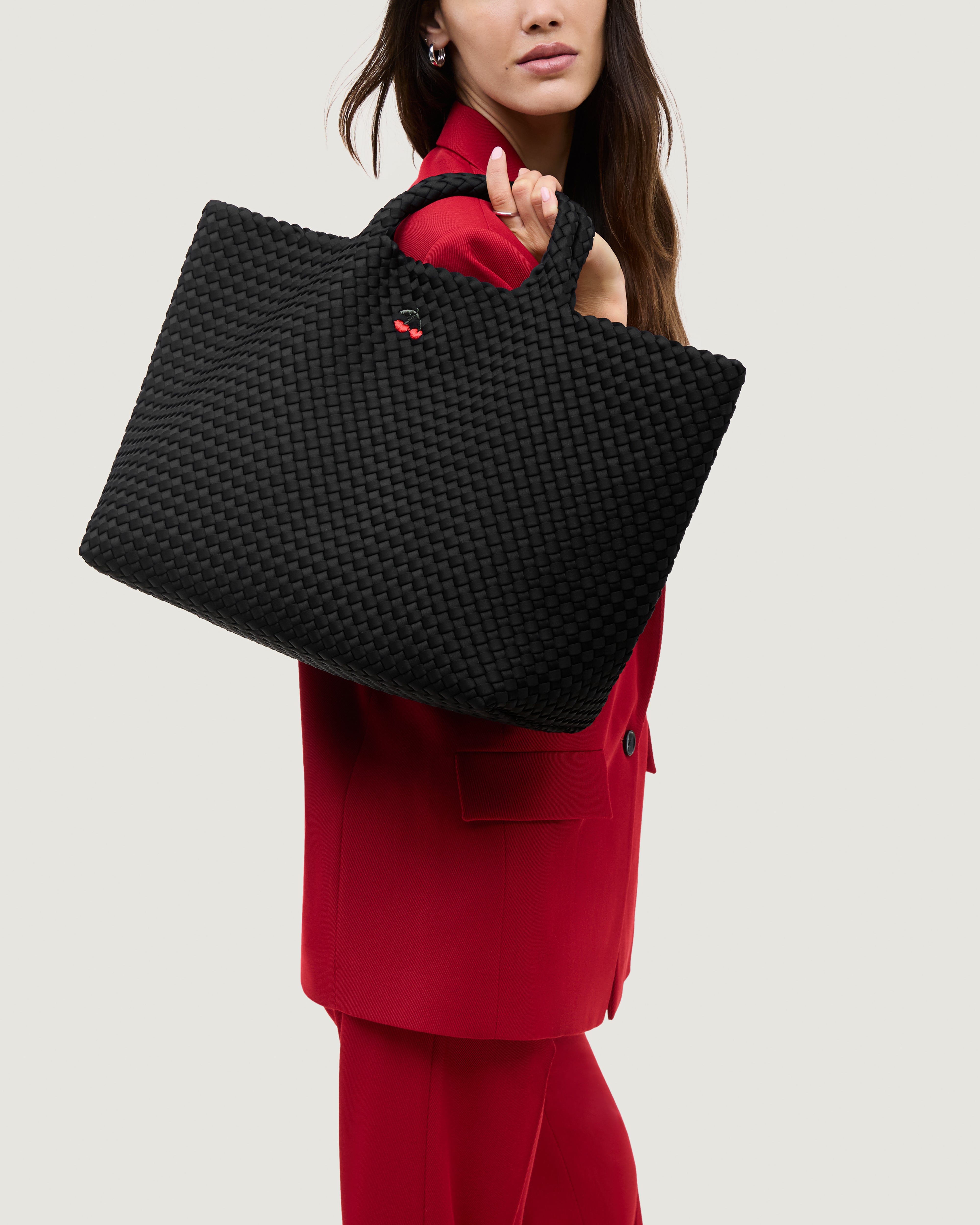St. Barths Tote in Onyx shown on model to illustrate scale and soft silhouette.