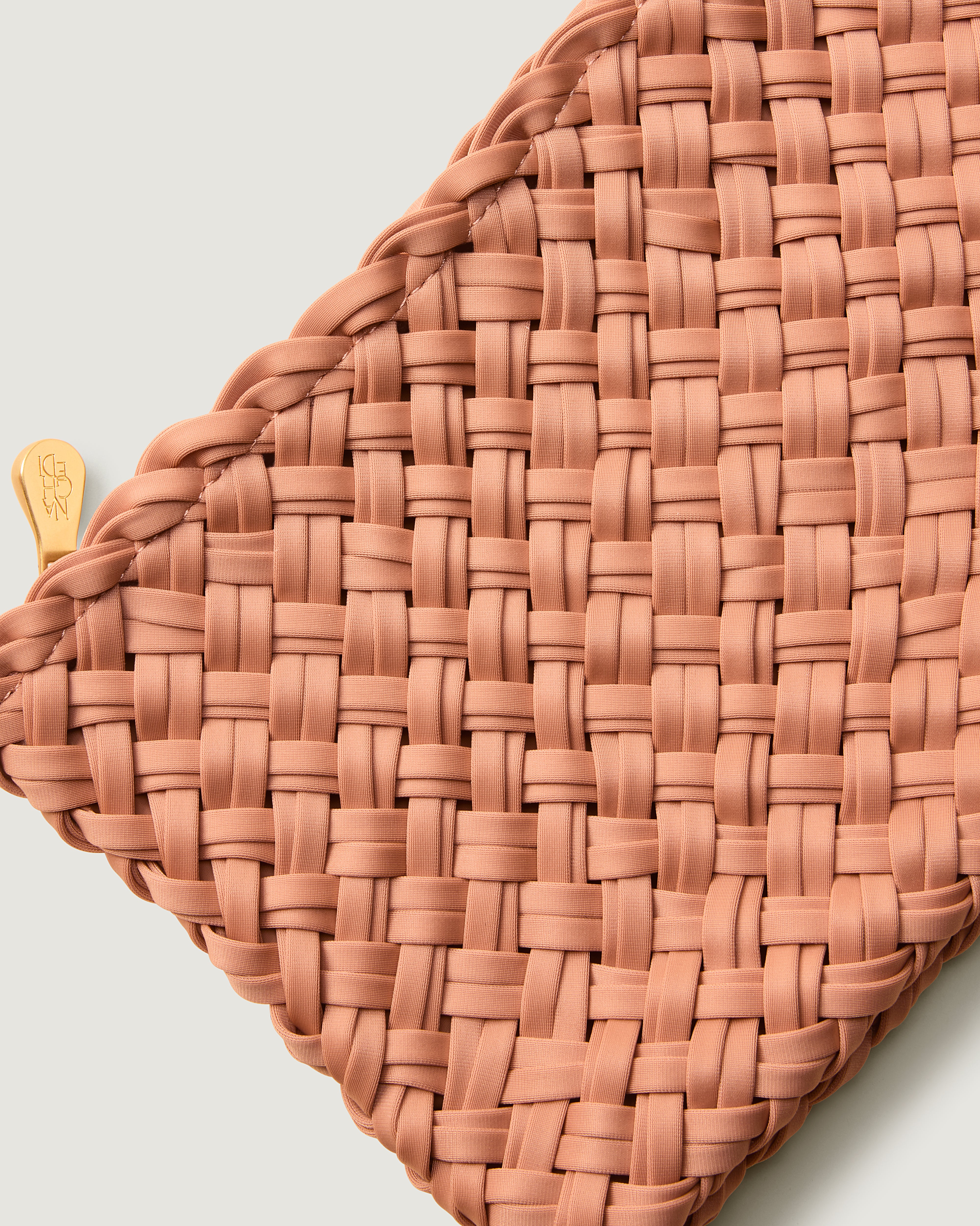 Close-up of included matching woven zippered pouch.