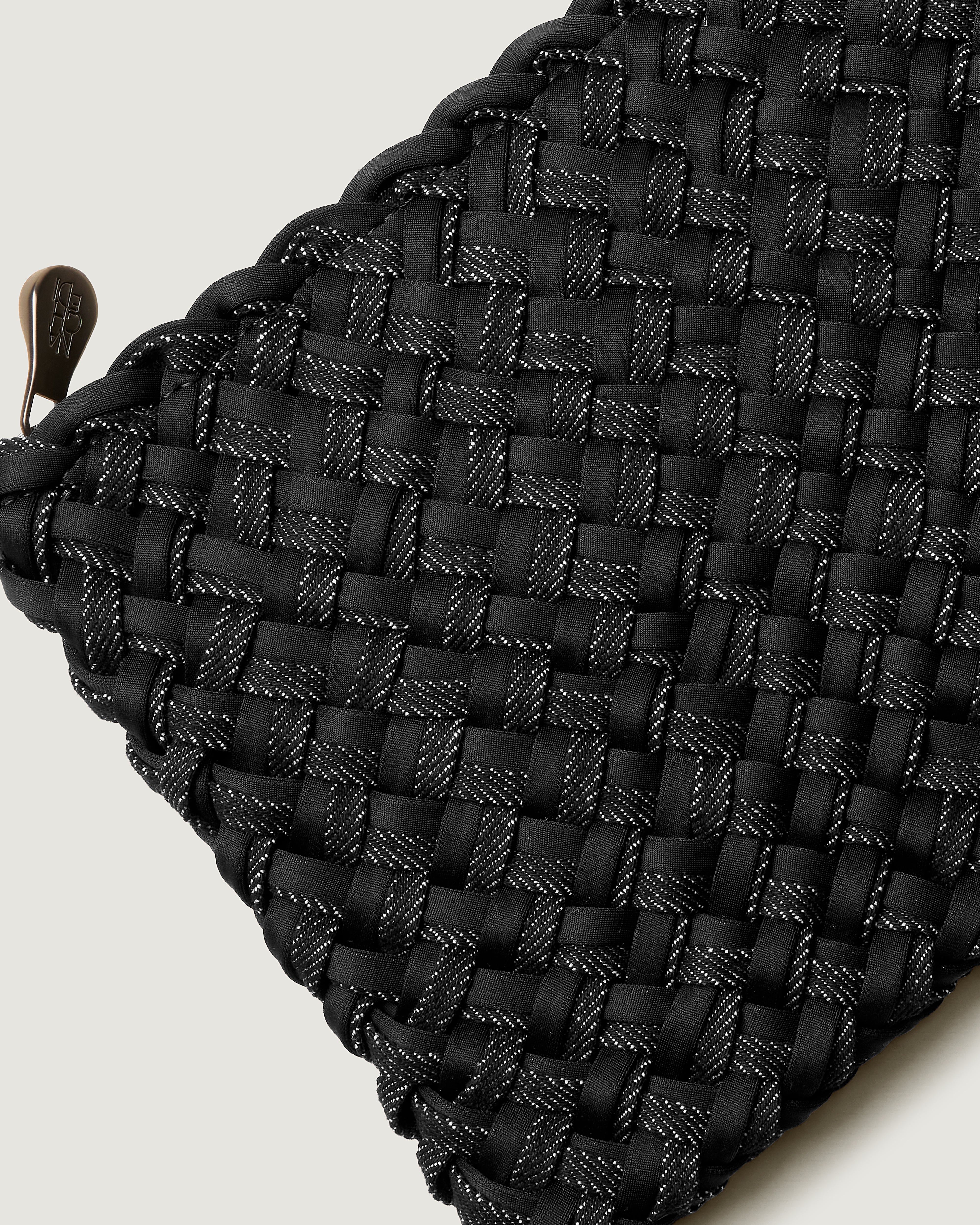Close-up of included matching woven zippered pouch.