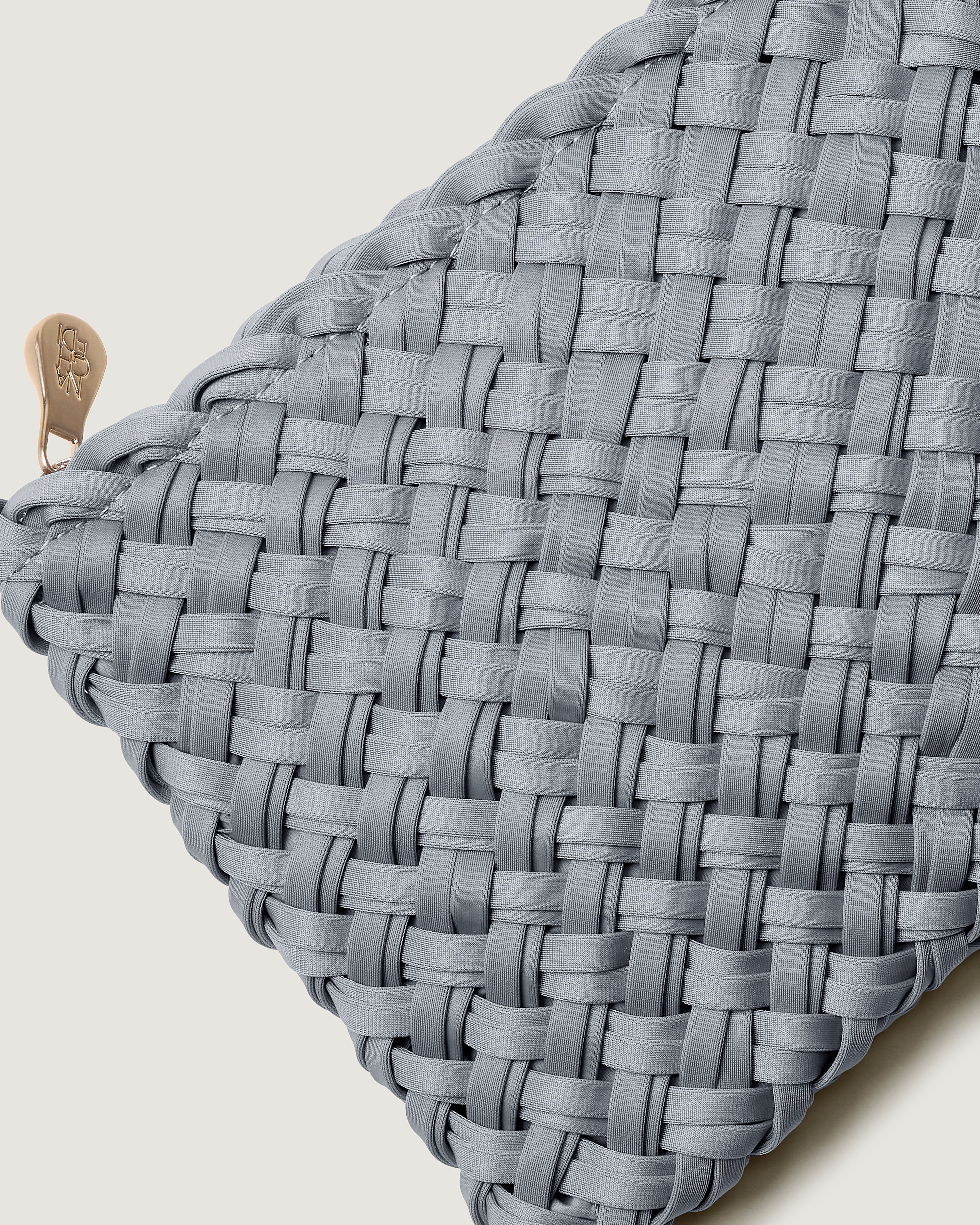 Close-up of included matching woven zippered pouch.