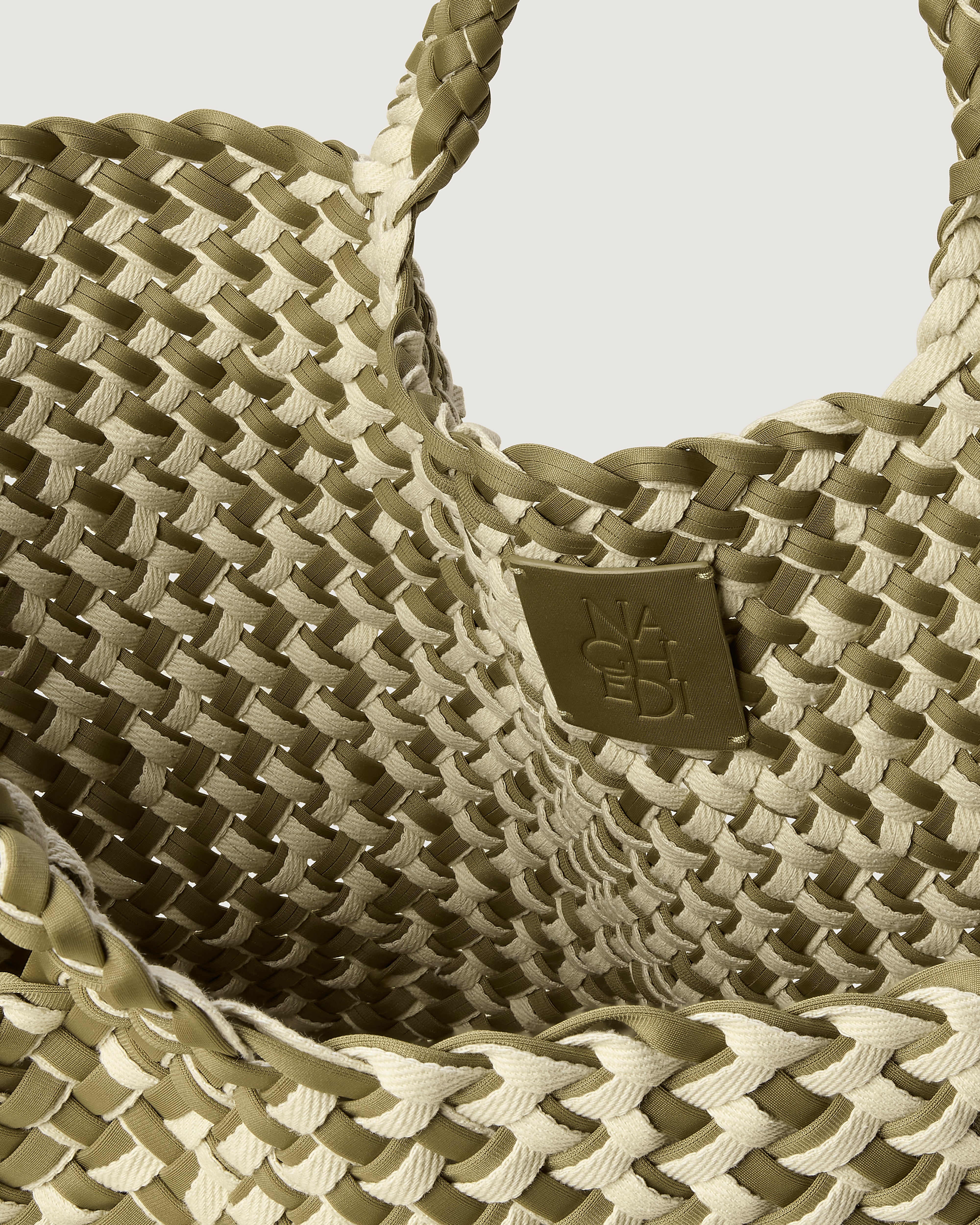 Interior close-up of St. Barths Tote in Oletta showing its open top, and unlined interior.
