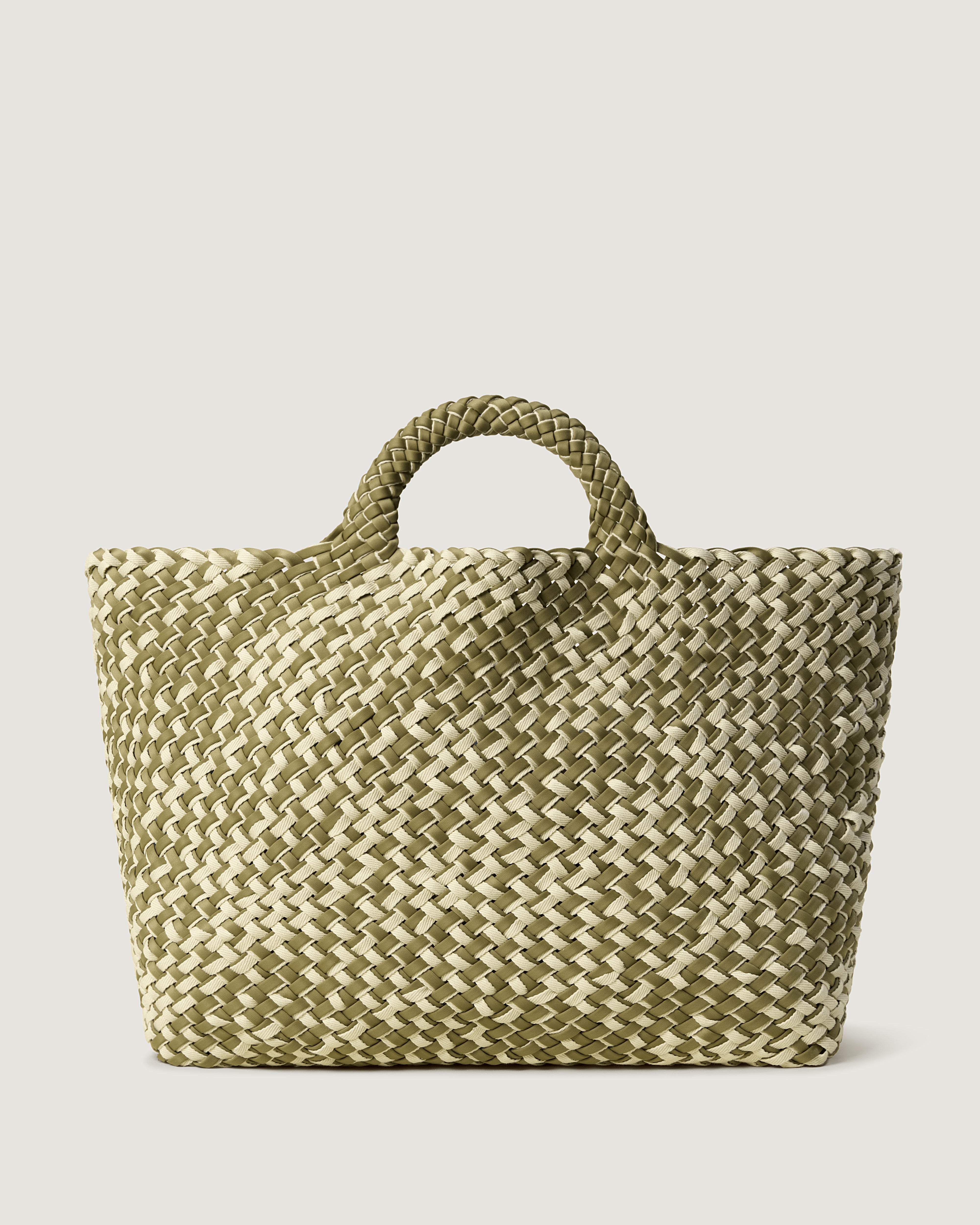 St. Barths Tote in Oletta, handwoven in muted bottle green neoprene with cream cotton. Featuring an open top, and woven top handles.