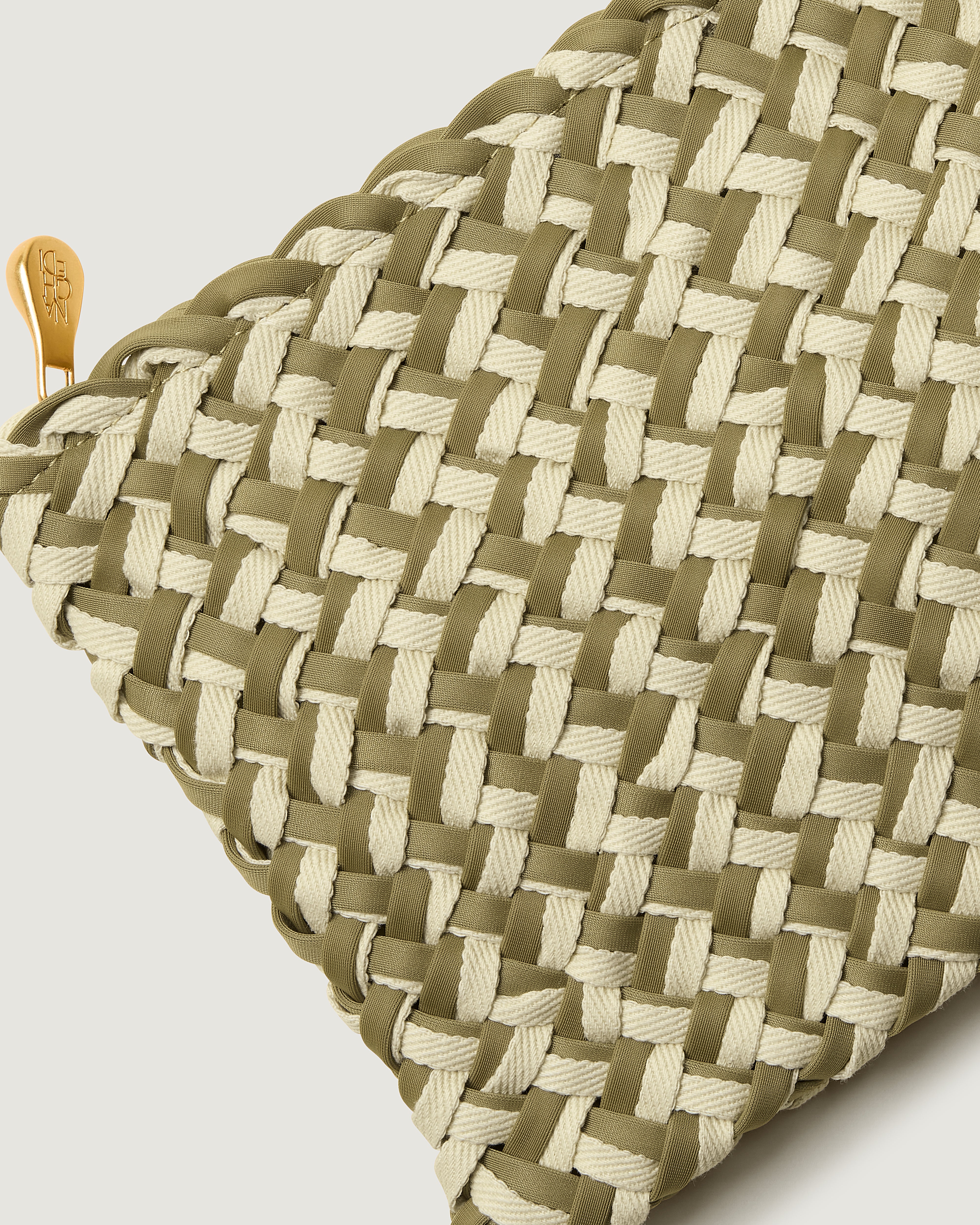 Close-up of included matching woven zippered pouch.