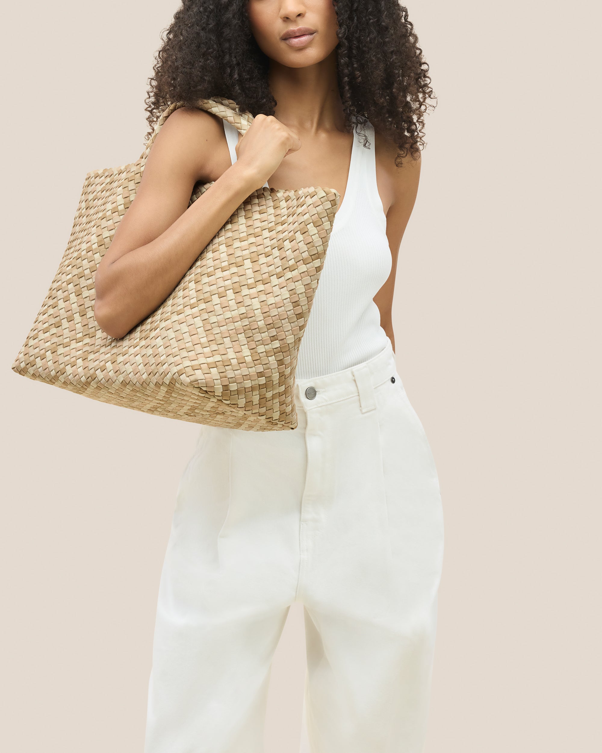 St. Barths Tote in Lanai shown on model to illustrate scale and soft silhouette.