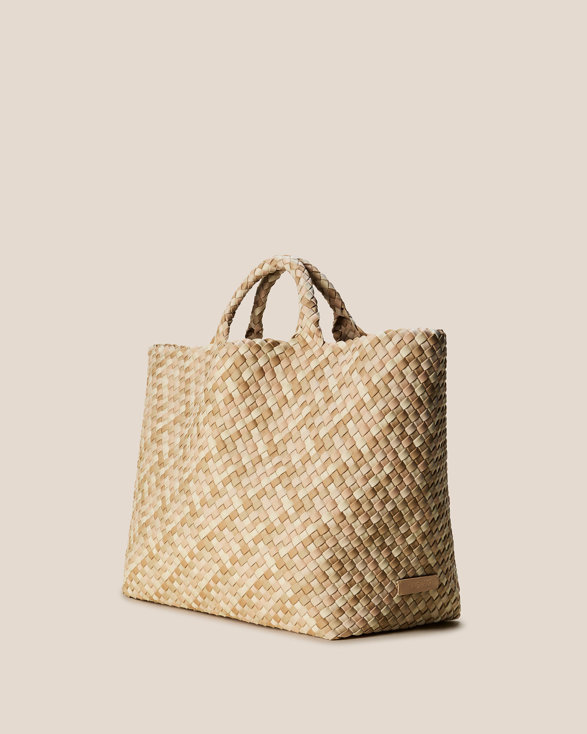 St. Barths Tote in Lanai shown from a side angle, highlighting its handwoven neoprene construction and open top.