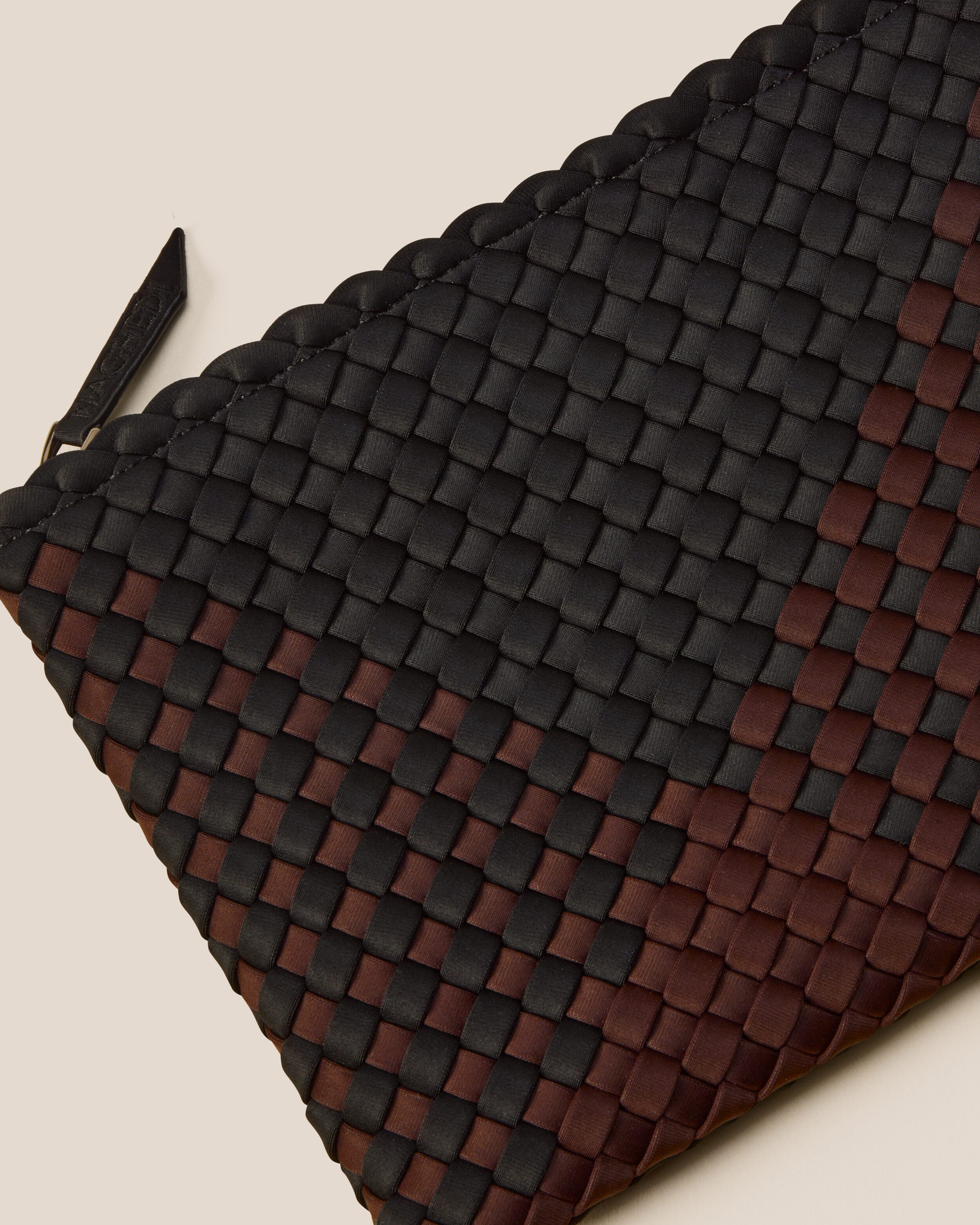 Close-up of included matching woven zippered pouch.