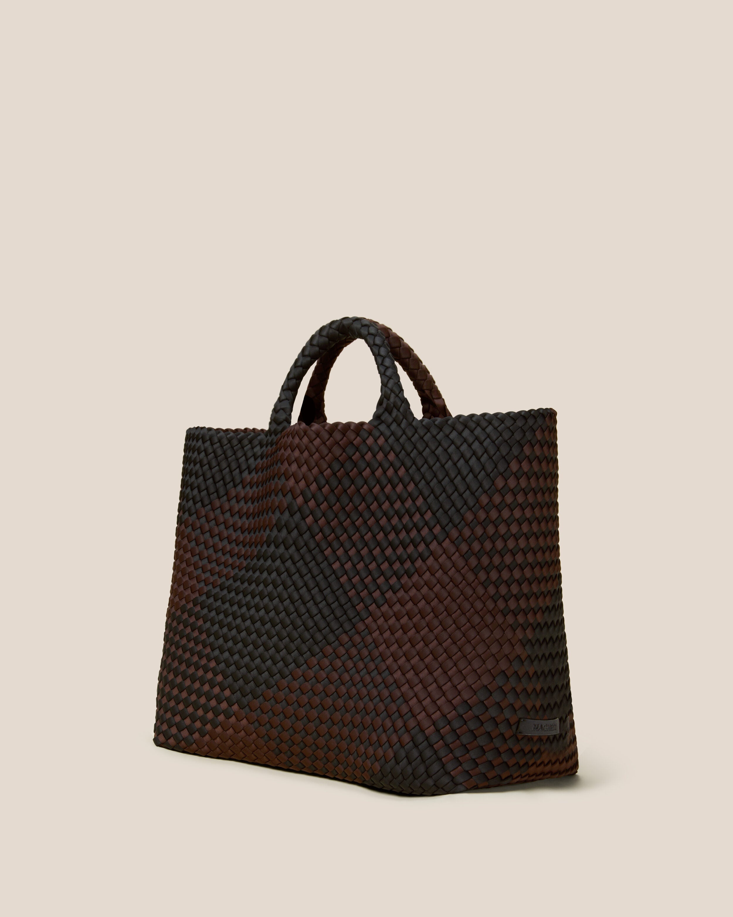 St. Barths Tote in Siena shown from a side angle, highlighting its handwoven neoprene construction and open top.