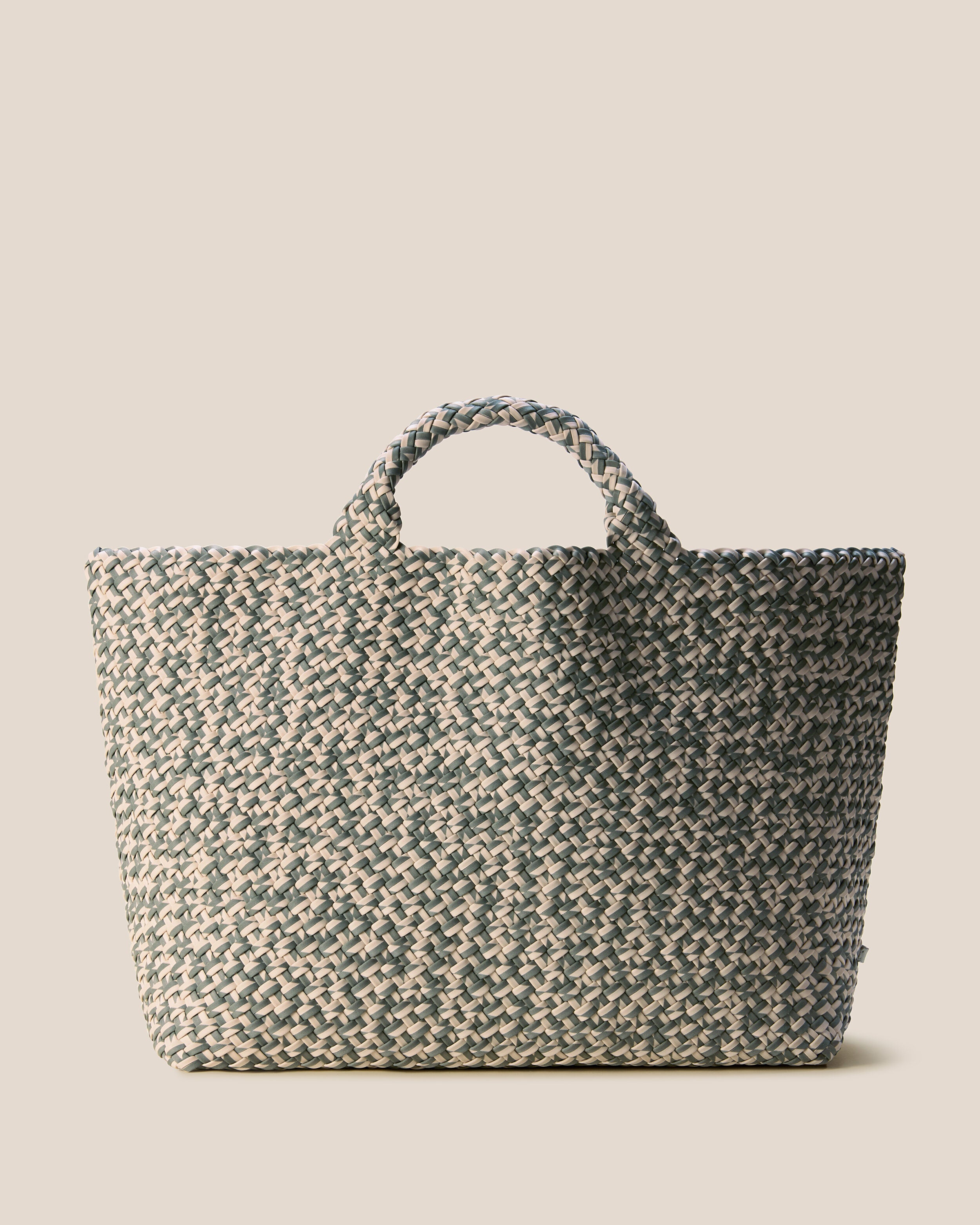 St. Barths Tote in Papyrus, a cream and light olive green tone, in handwoven neoprene, featuring an open top, and woven top handles.