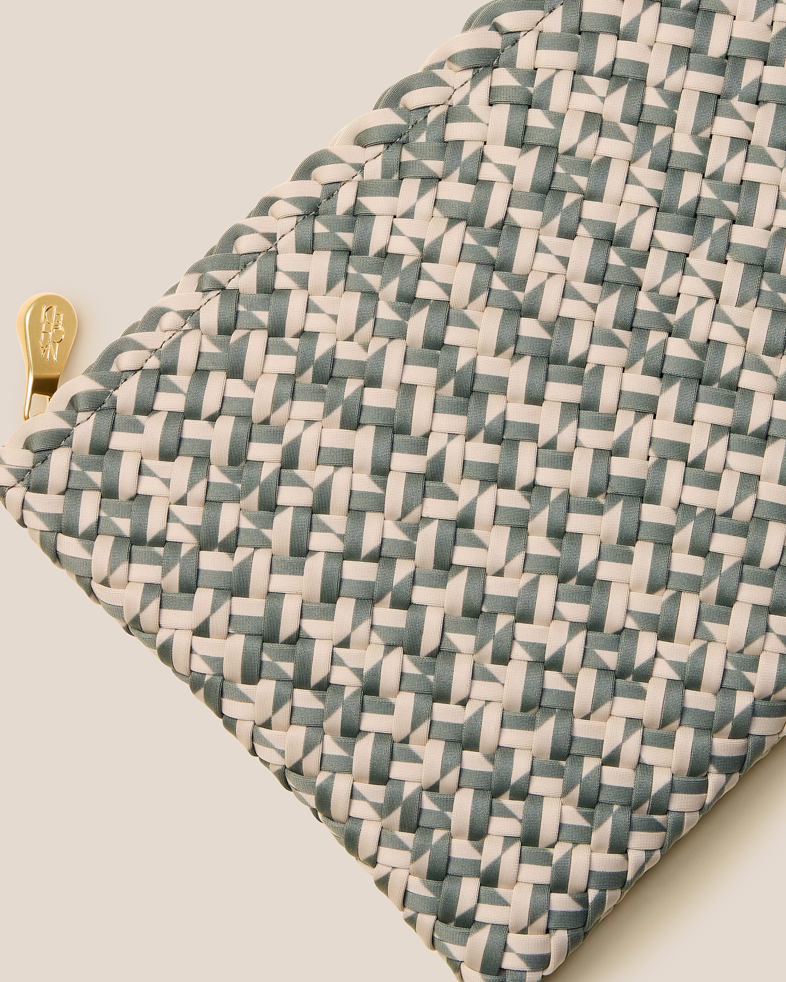 Close-up of included matching woven zippered pouch.