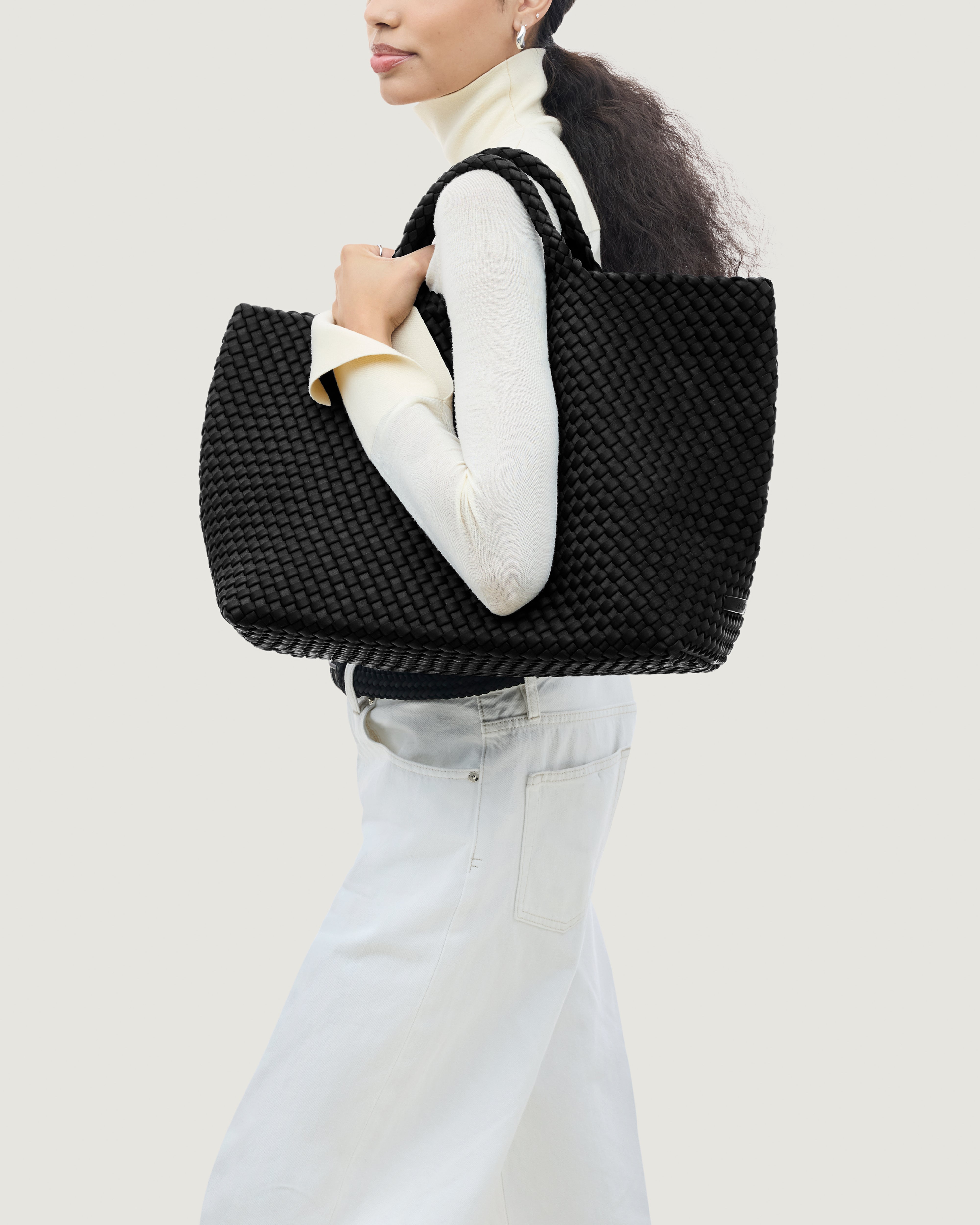 St. Barths Tote in Onyx shown on model to illustrate scale and soft silhouette.