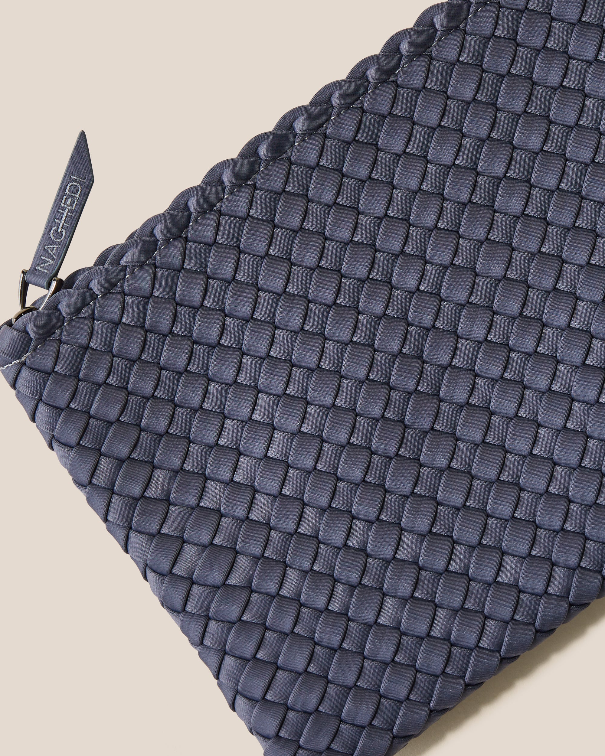 Close-up of included matching woven zippered pouch.