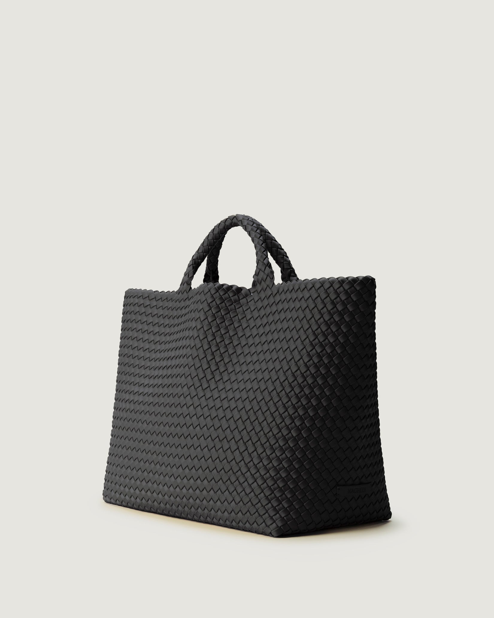 St. Barths Large Tote Bag in Ash shown from a side angle, highlighting its handwoven neoprene and open top.
