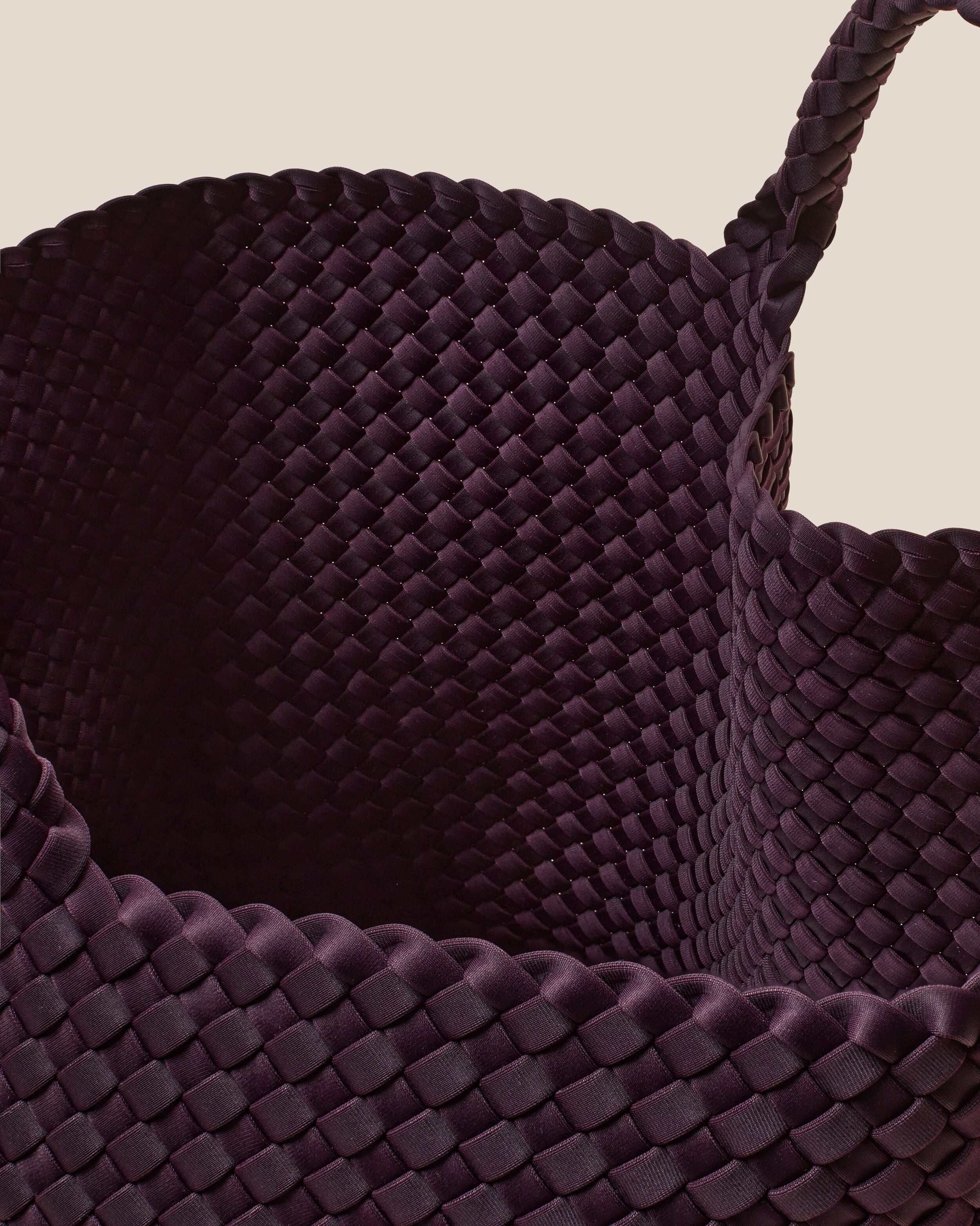 Interior close-up of St. Barths Tote in Aubergine showing its open top, and unlined interior.