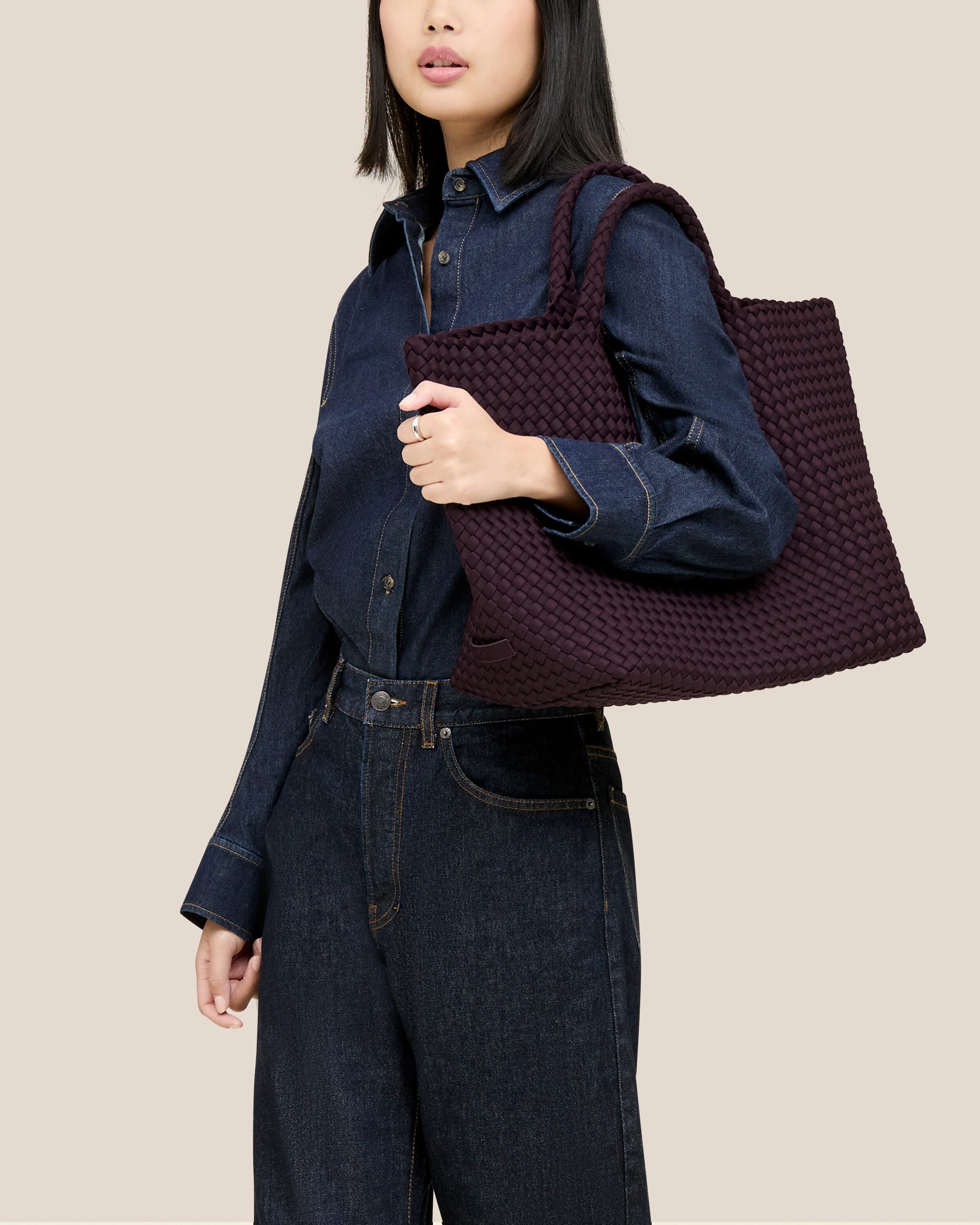 St. Barths Tote in Aubergine shown on model to illustrate scale and soft silhouette.