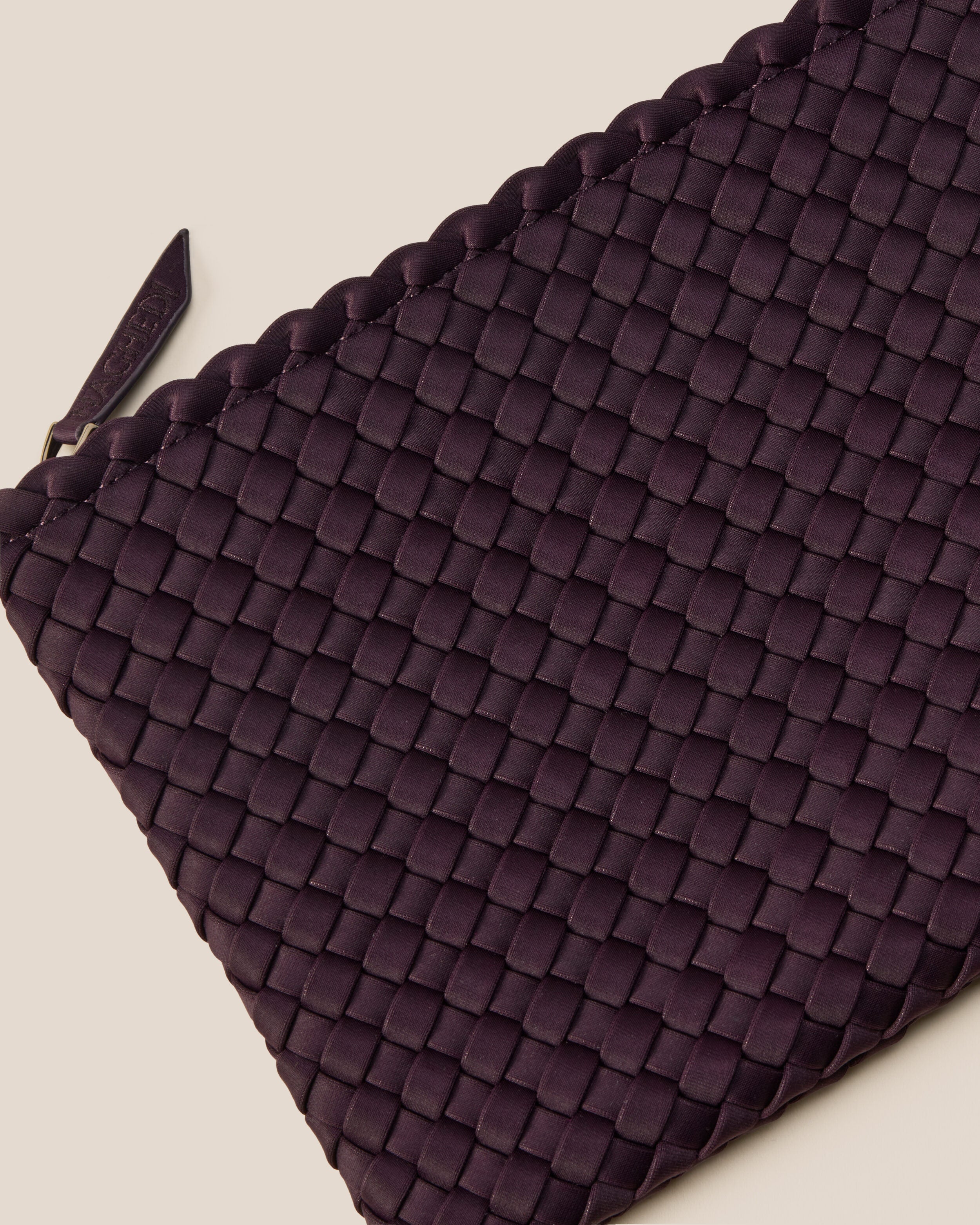 Close-up of included matching woven zippered pouch.