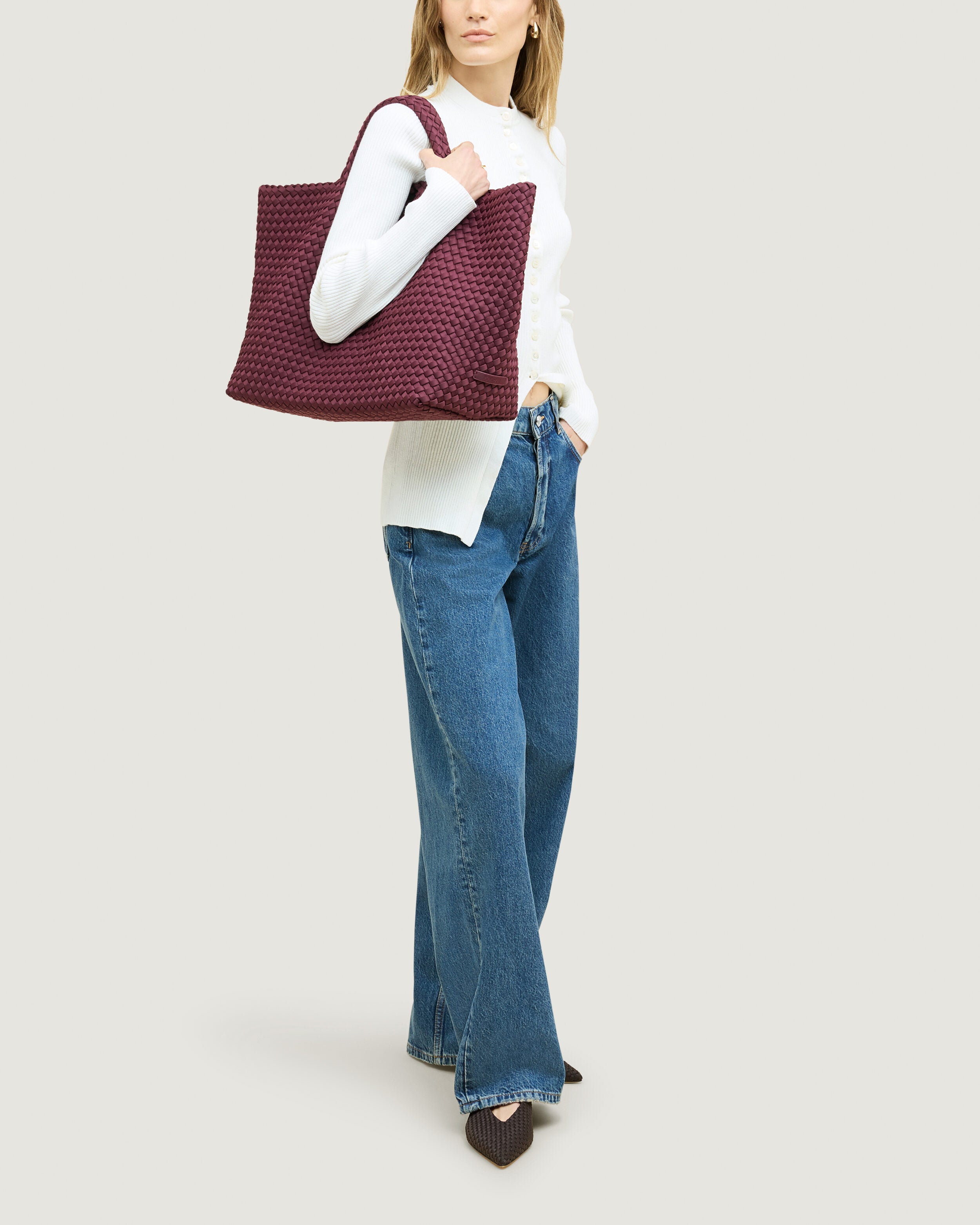 St. Barths Tote in Bordeaux shown on model to illustrate scale and soft silhouette.