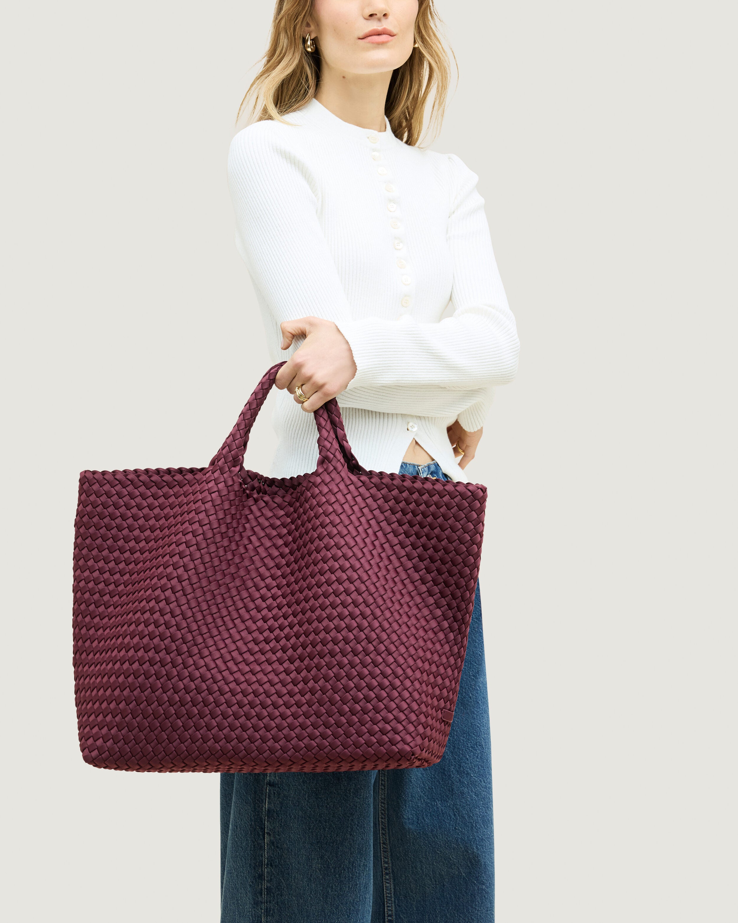 St. Barths Tote in Bordeaux shown on model to illustrate scale and soft silhouette.